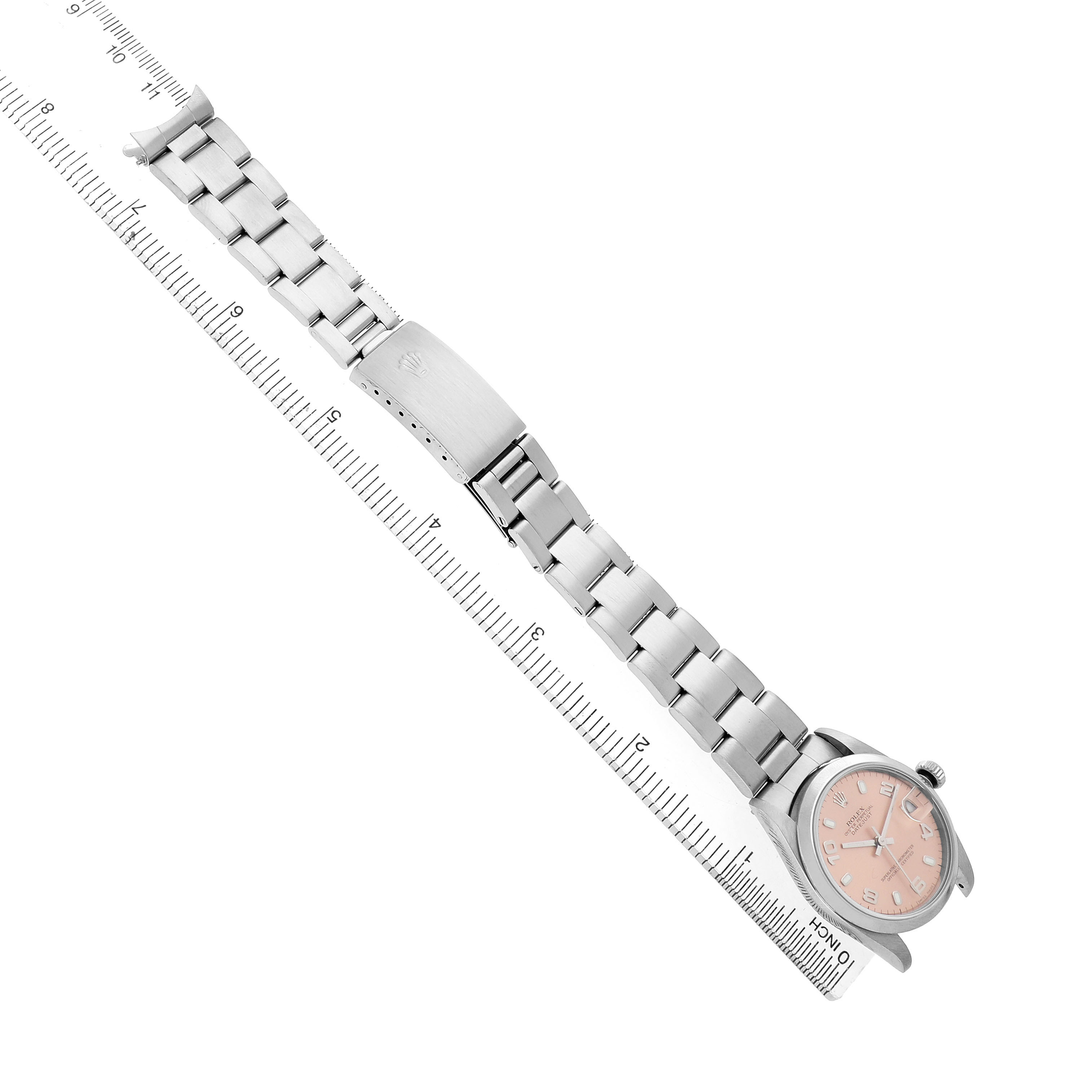 The image shows a Rolex Mid-Size 78240 Women's Stainless Steel Pink Dial watch at an angled top view, featuring the watch face, bracelet, and clasp near a ruler for scale.