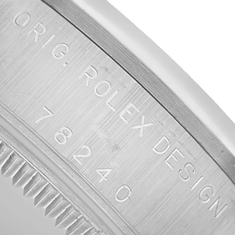The image shows the edge of the case back of a Rolex Mid-Size 78240 Women's Stainless Steel Pink Dial watch, focusing on the engraved model and brand details.