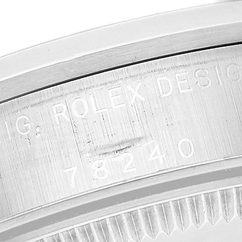This is a close-up angle showing the engraved model number and branding on the bezel of a Rolex Mid-Size 78240 Women's Stainless Steel White Dial 78240 Women's Stainless Steel White Dial watch.