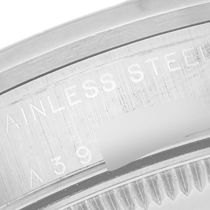 The image shows a close-up of the stainless steel case back with an engraved serial number of the Rolex Mid-Size 78240 Women's Stainless Steel White Dial 78240 Women's Stainless Steel White Dial model watch.