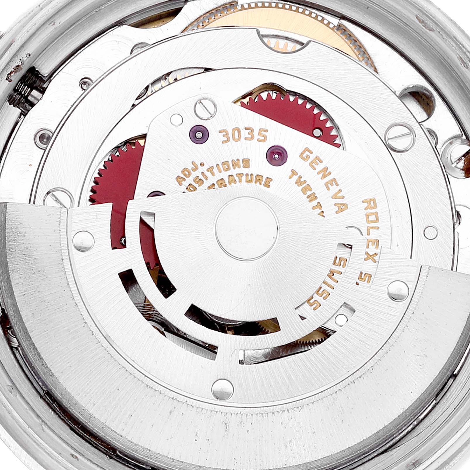 The image shows a close-up of the movement of the Vintage Collection model by Rolex, featuring gears and engraved details.