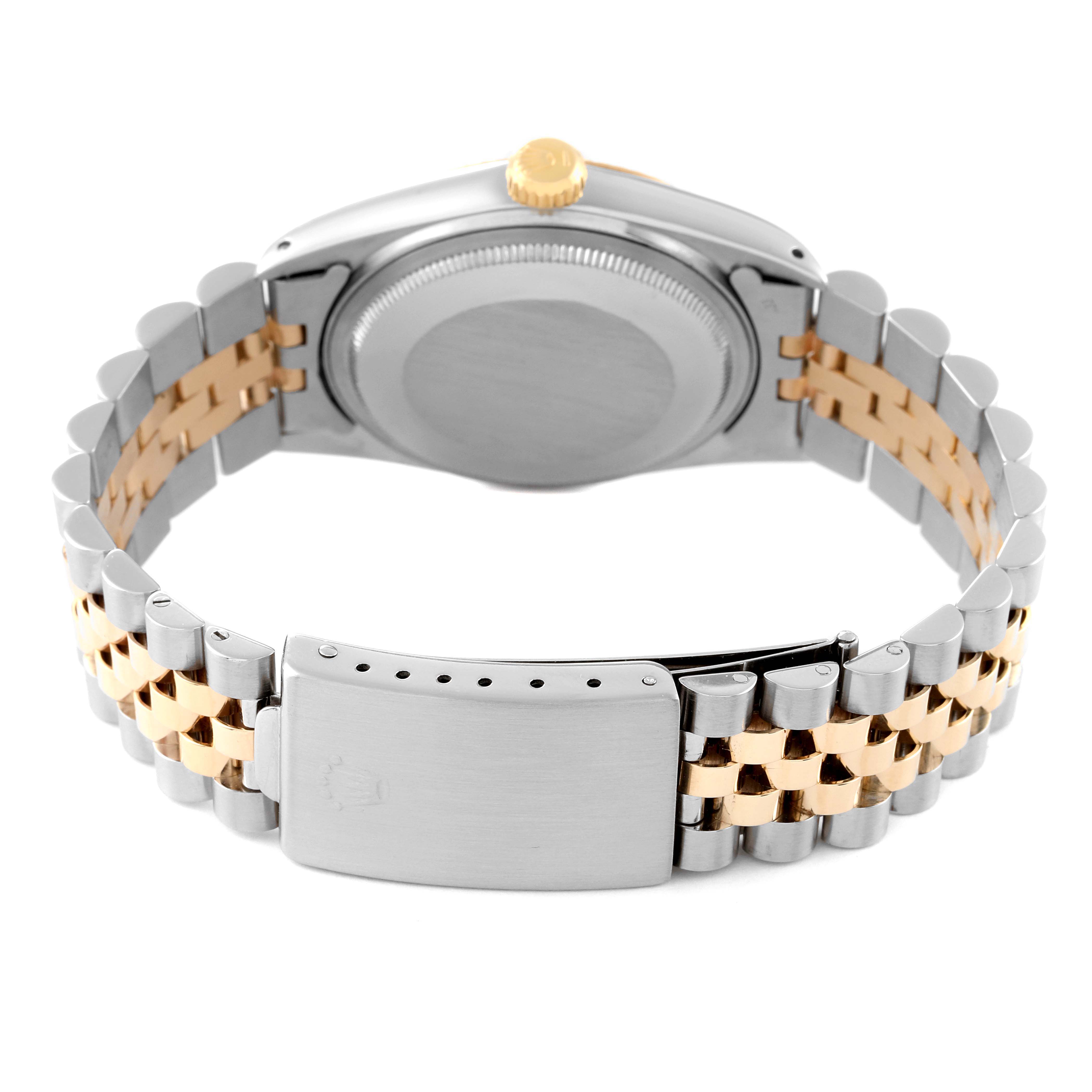 The image shows the back and bracelet of a Rolex Vintage Collection 16013 Men
s Steel and Gold (two tone) Champagne Dial 16013 Men
s Steel and Gold (two tone) Champagne Dial watch, highlighting the clasp and bi-metallic links.