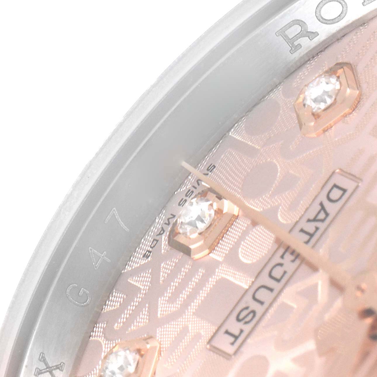 This is a close-up angle showing part of the dial and bezel of a Rolex Datejust 116231 Men's Steel and Gold (two tone) Pink Dial 116231 Men's Steel and Gold (two tone) Pink Dial watch.