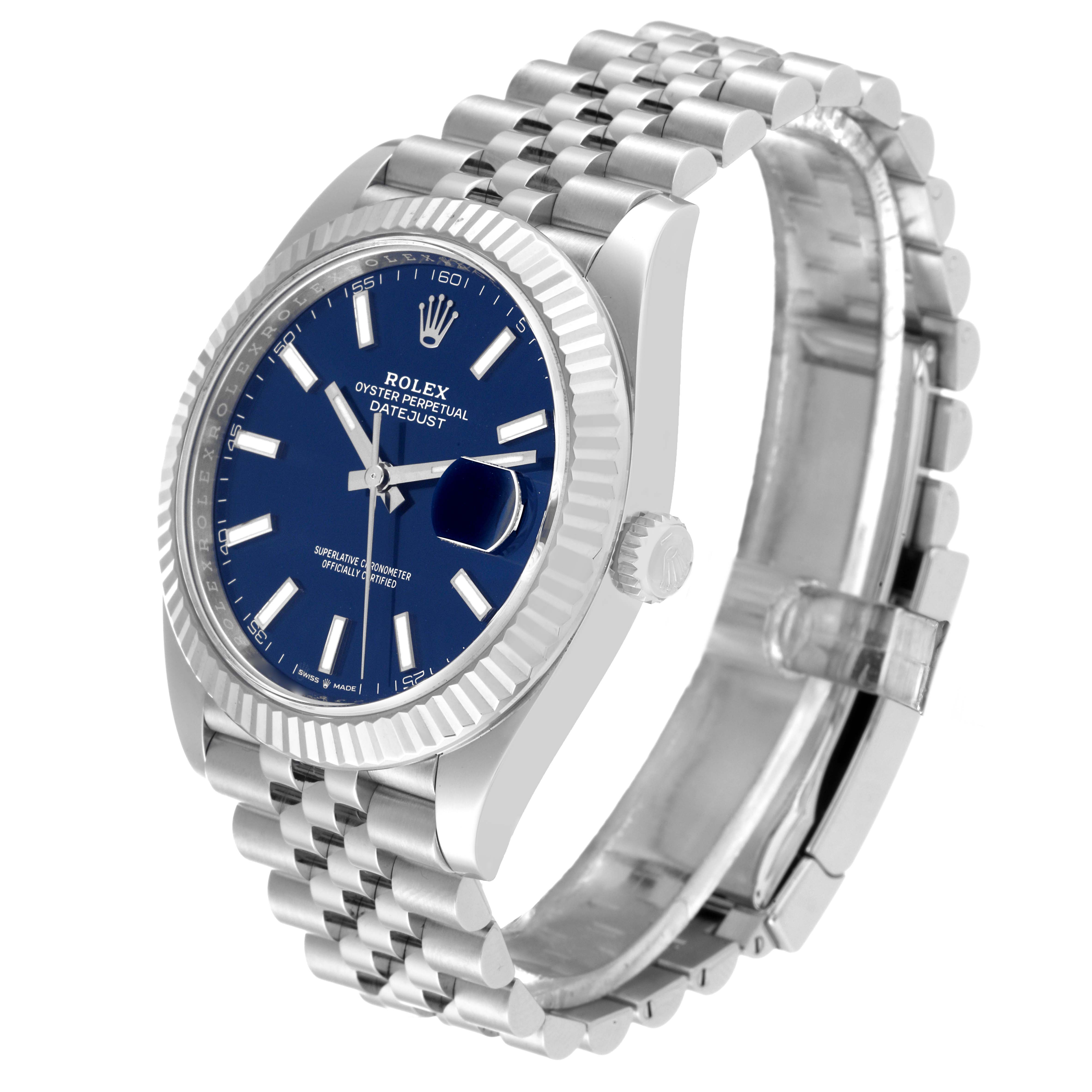 The image shows a Rolex Datejust 41 126334 Men
s Stainless Steel Blue Dial 126334 Men
s Stainless Steel Blue Dial watch from an angled perspective, highlighting its blue dial, fluted bezel, and Jubilee bracelet.