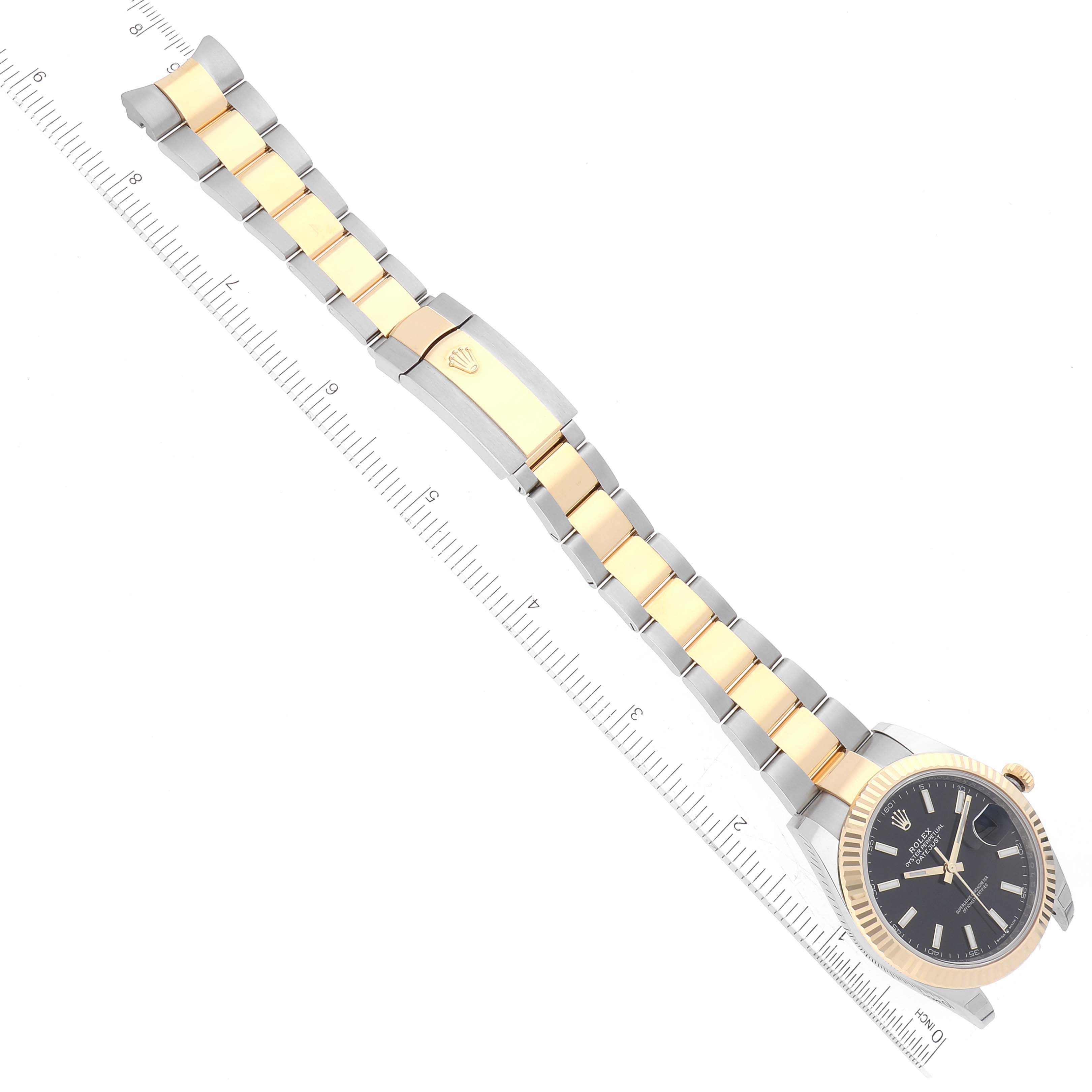 The image shows a top-down view of a Rolex Datejust 41 126333 Men's Steel and Gold (two tone) Black Dial 126333 Men's Steel and Gold (two tone) Black Dial watch, highlighting its two-tone bracelet and partially visible dial.