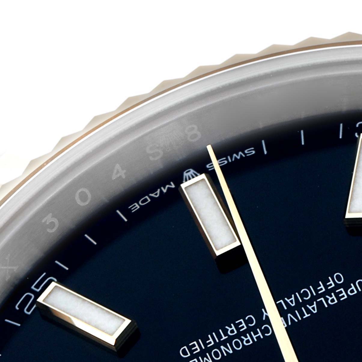 The image shows a close-up of the dial and bezel of a Rolex Datejust 41 126333 Men's Steel and Gold (two tone) Black Dial, focusing on the hour markers and hands.