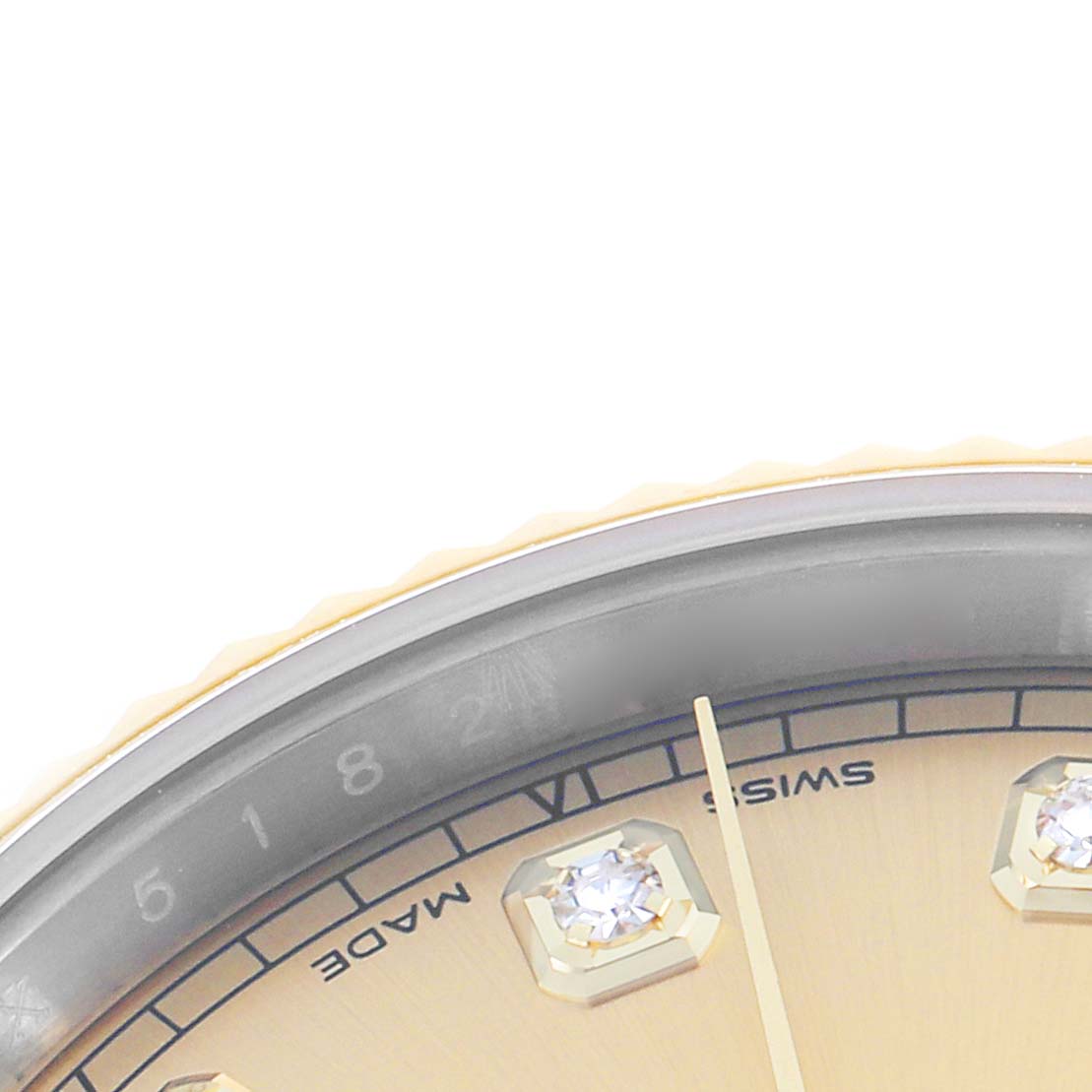 The image shows a partial close-up of the Rolex Datejust 41 126333 Men
s Steel and Gold (two tone) Champagne Dial dial, including the bezel, hour markers, and hands at an angled view.