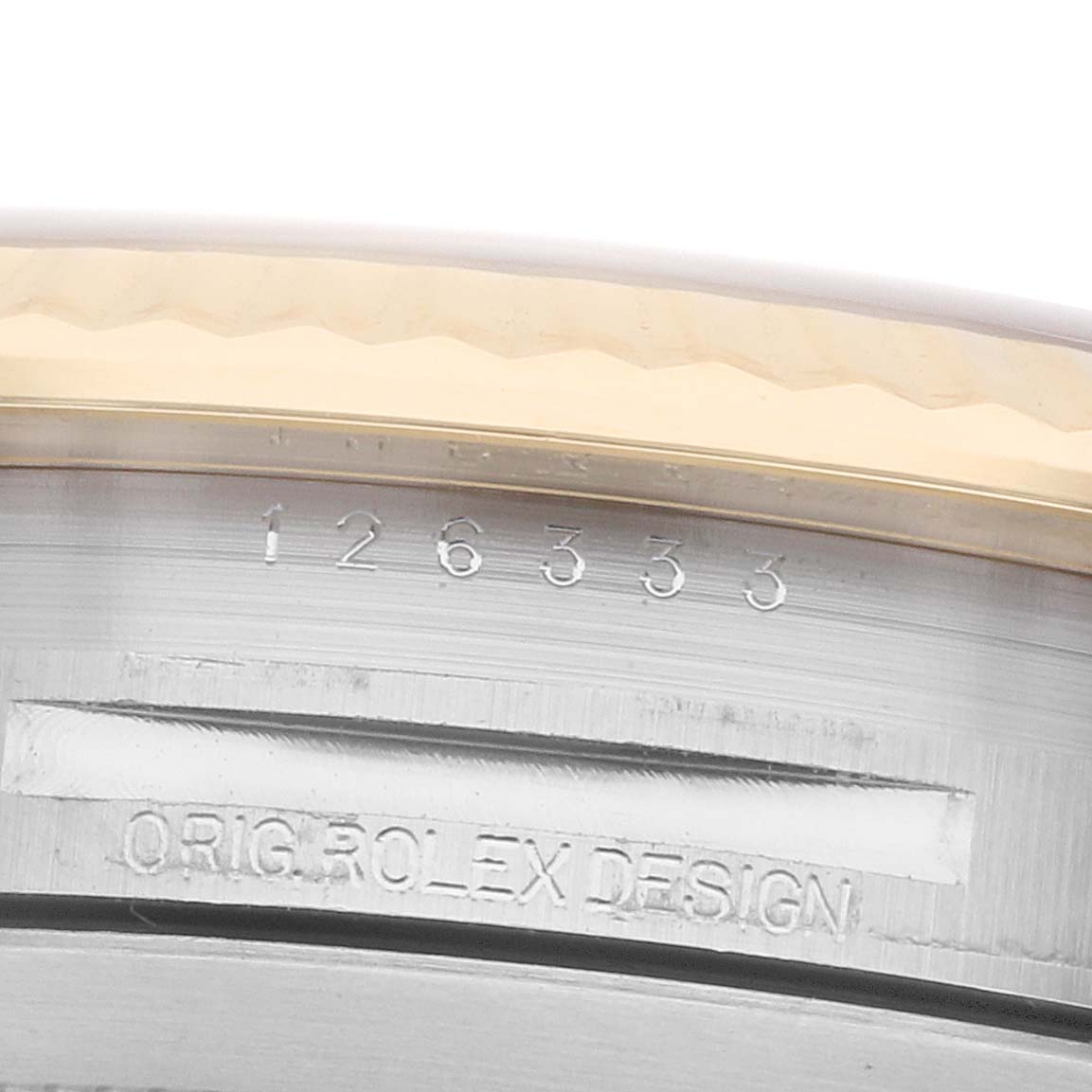 The image shows a close-up of the case side, bezel, and engraving details on a Rolex Datejust 41 126333 Men
s Steel and Gold (two tone) Champagne Dial.