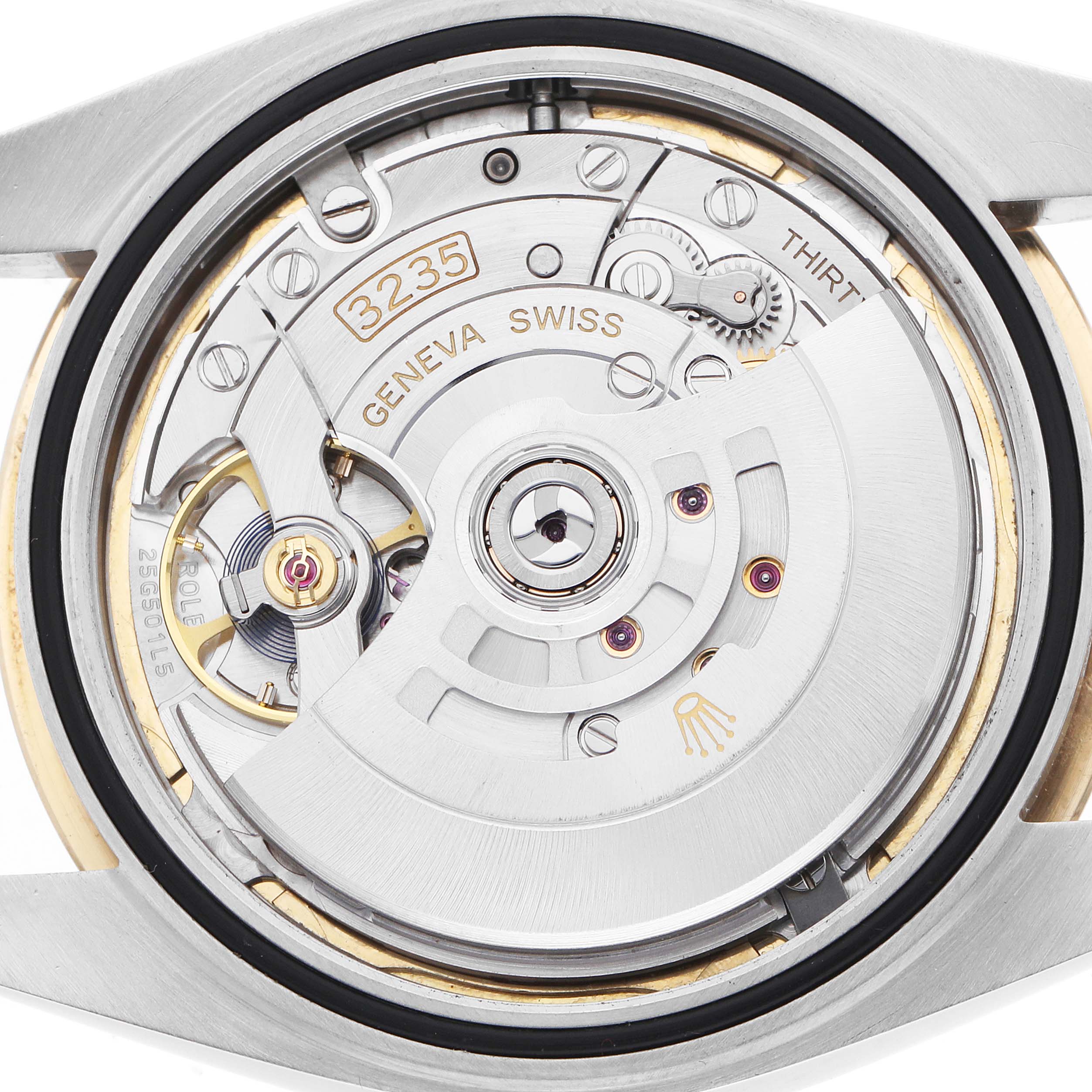 This image shows the back view of a Rolex Datejust 41 126333 Men
s Steel and Gold (two tone) Champagne Dial, highlighting its intricate movement and components.