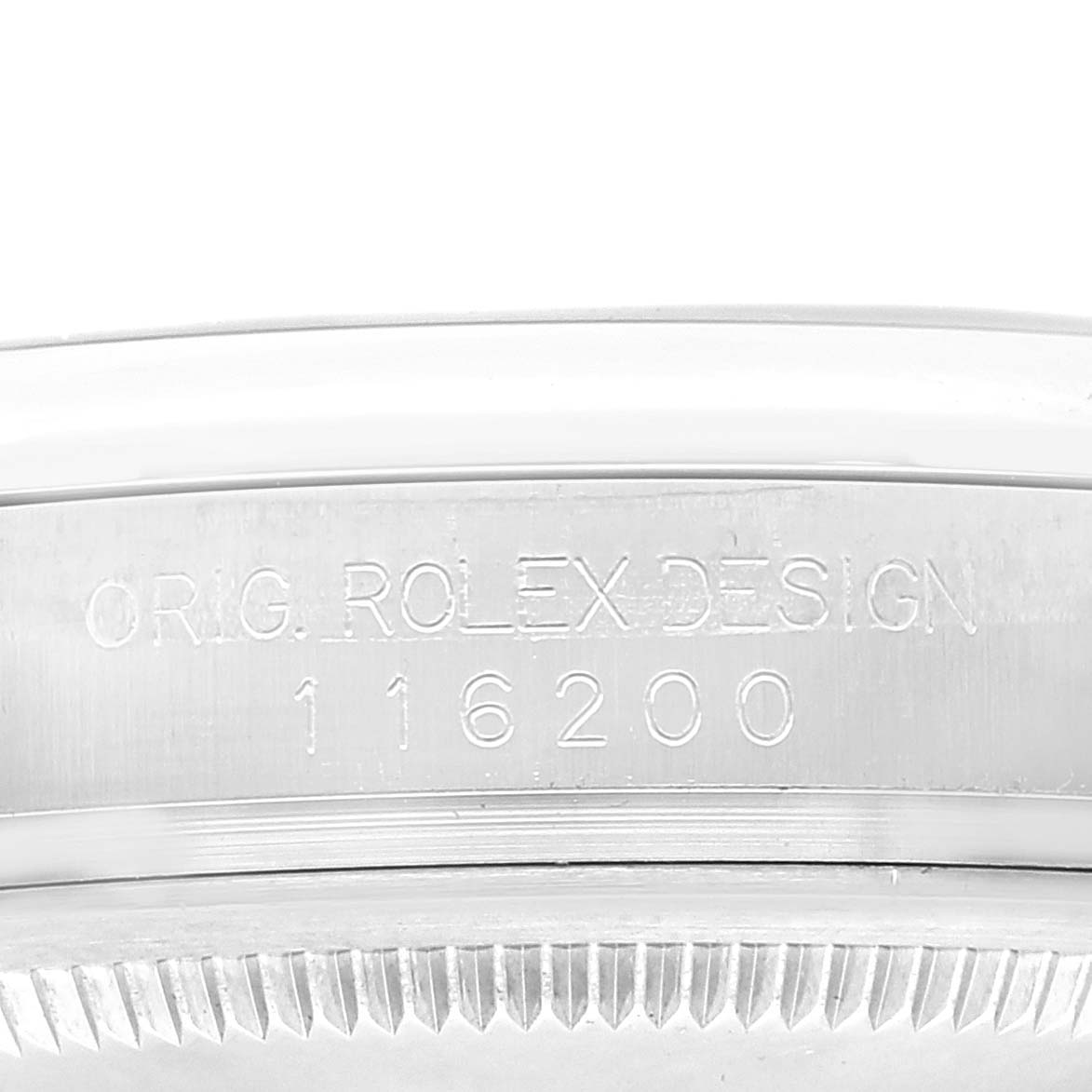 This image shows a close-up of the case side of a Rolex Datejust 116200 Men's Stainless Steel Blue Dial 116200 Men's Stainless Steel Blue Dial, highlighting the engraved model number "116200."