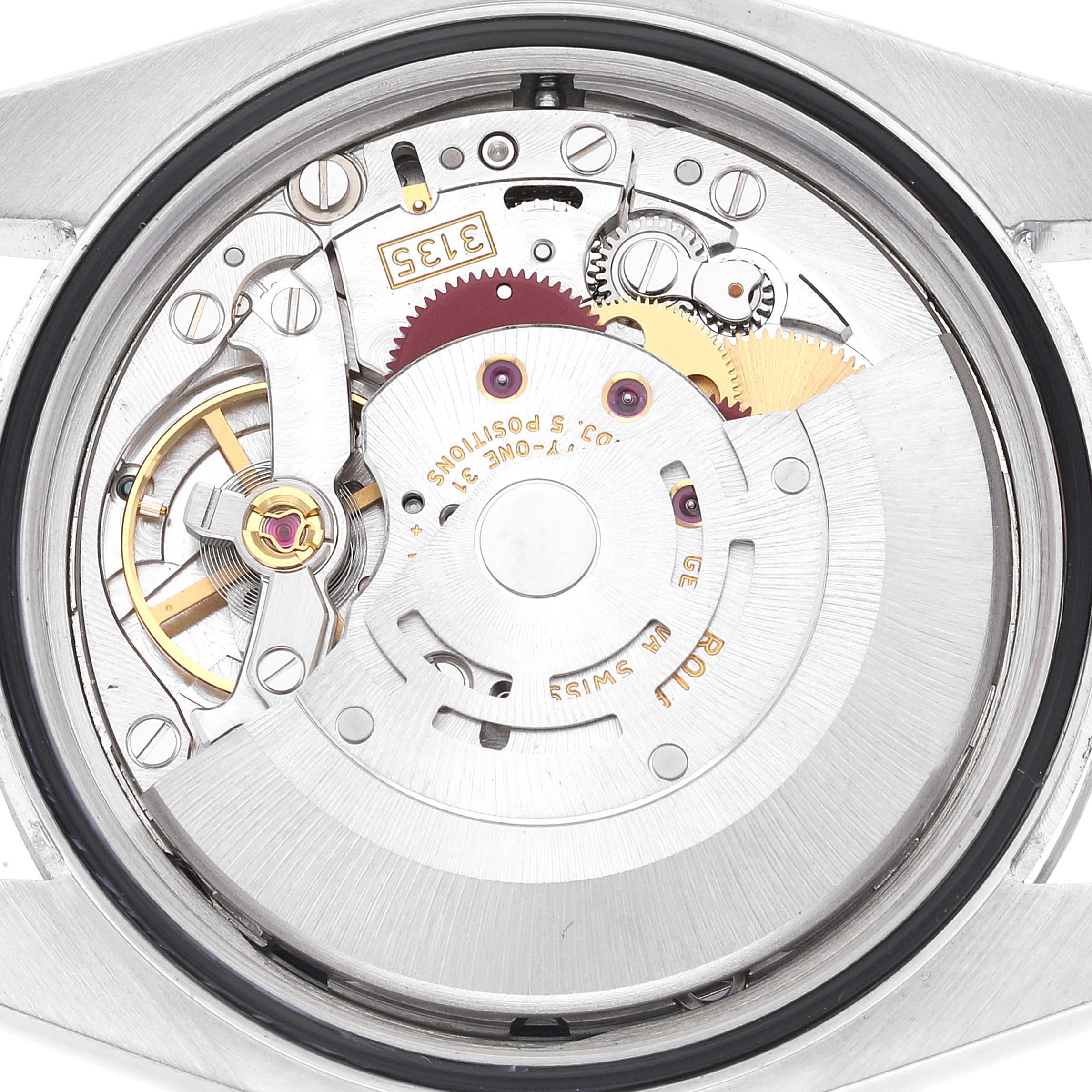 This image shows the inner movement mechanics of a Rolex Datejust 116200 Men's Stainless Steel Blue Dial 116200 Men's Stainless Steel Blue Dial watch from a top-down angle.