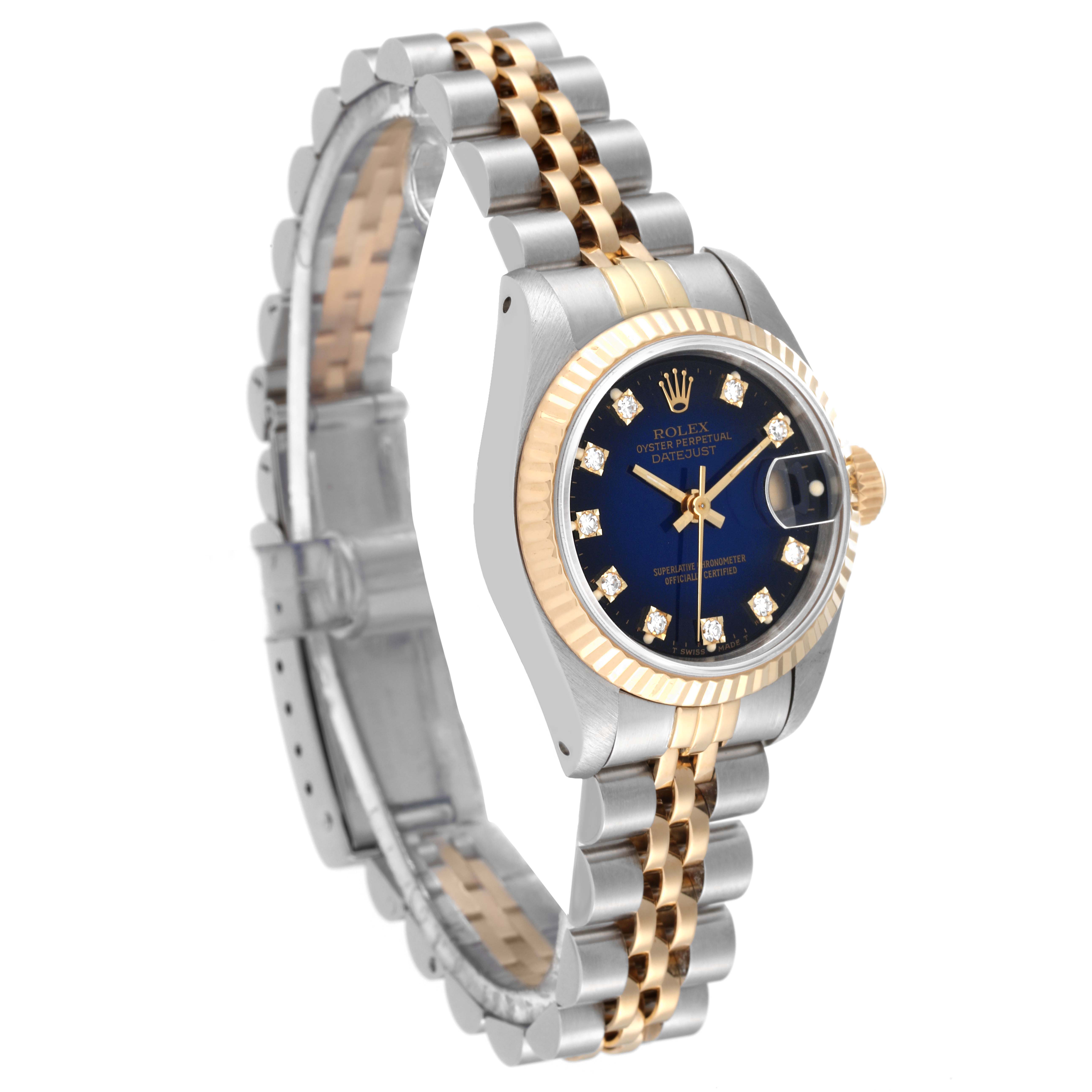 This image shows a Rolex Datejust 69173 Women's Steel and Gold (two tone) Blue Dial 69173 Women's Steel and Gold (two tone) Blue Dial watch at a slight angle, highlighting its bicolored bracelet, fluted bezel, and black dial with diamond markers.