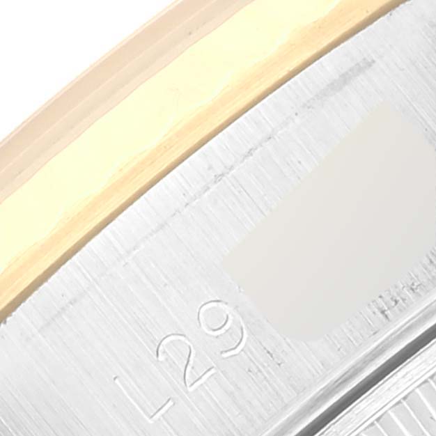 Close-up of the Rolex Datejust 69173 Women's Steel and Gold (two tone) Blue Dial 69173 Women's Steel and Gold (two tone) Blue Dial watch's case edge, highlighting the model engraving and part of the bezel.