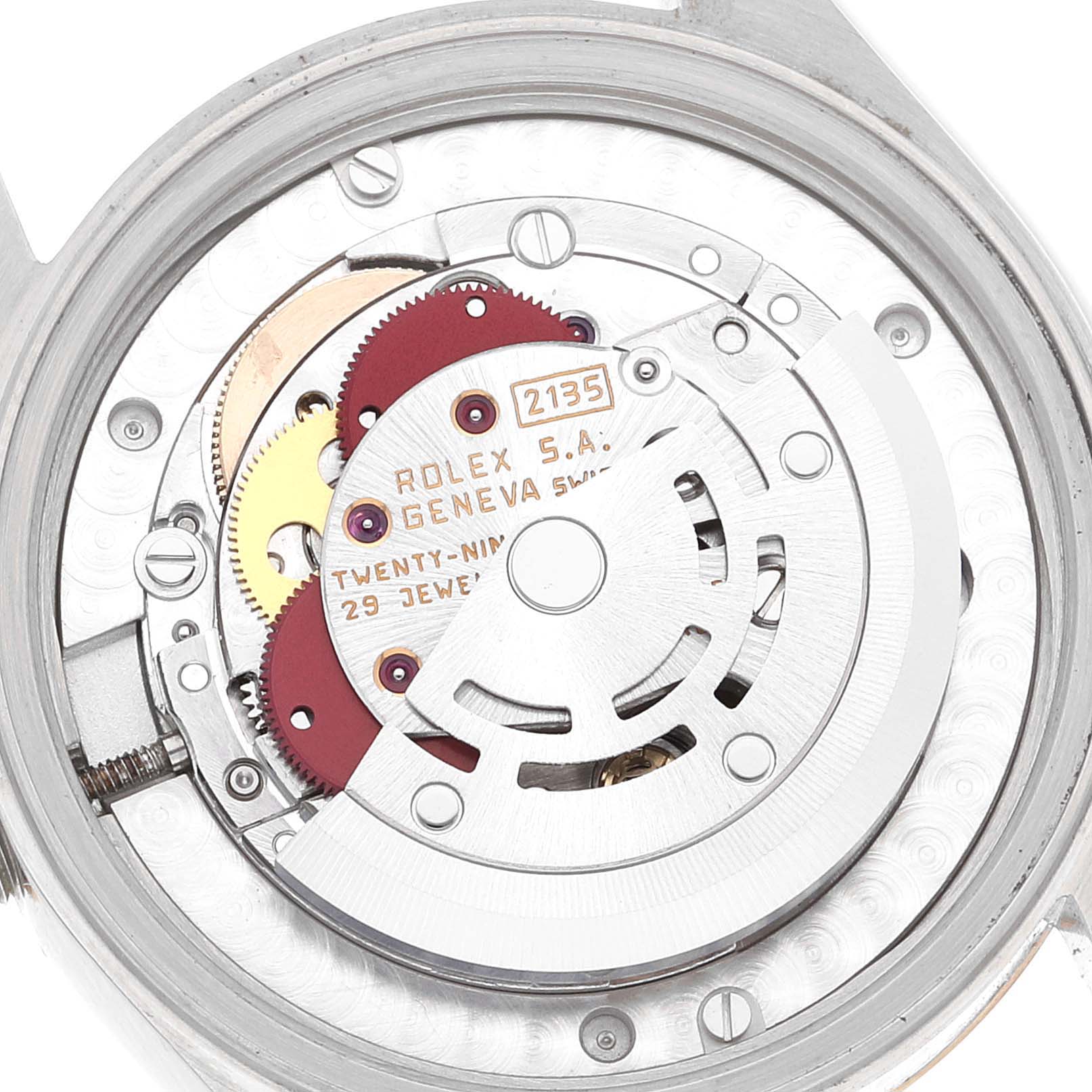 The image shows the internal mechanism and movement of a Rolex Mid-Size 68273 Women
s Steel and Gold (two tone) White Dial 68273 Women
s Steel and Gold (two tone) White Dial watch, model number 2135.