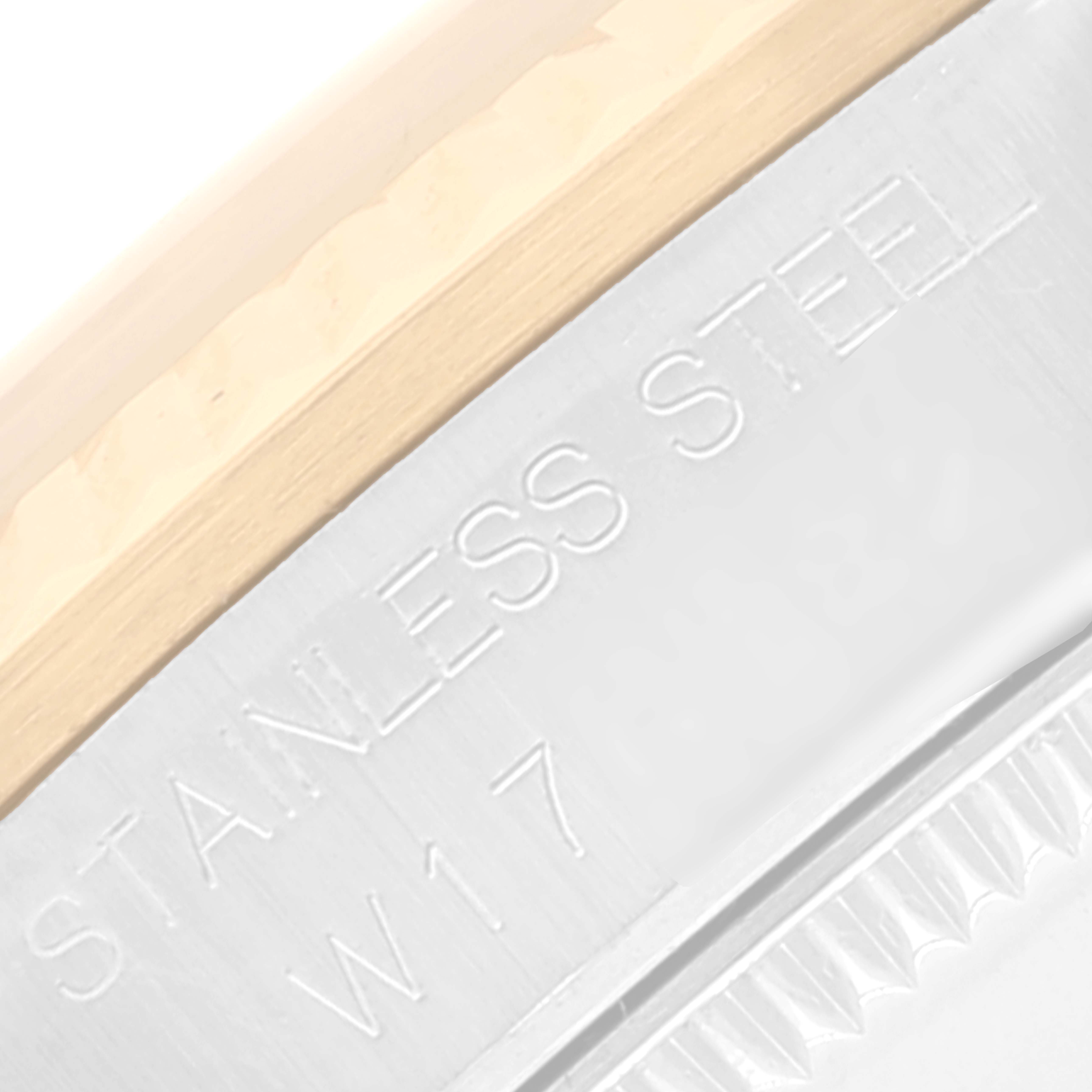 The close-up image shows part of the back case of a Rolex Mid-Size 68273 Women
s Steel and Gold (two tone) Black Dial 68273 Women
s Steel and Gold (two tone) Black Dial watch, featuring the text "STAINLESS STEEL" and "W17."