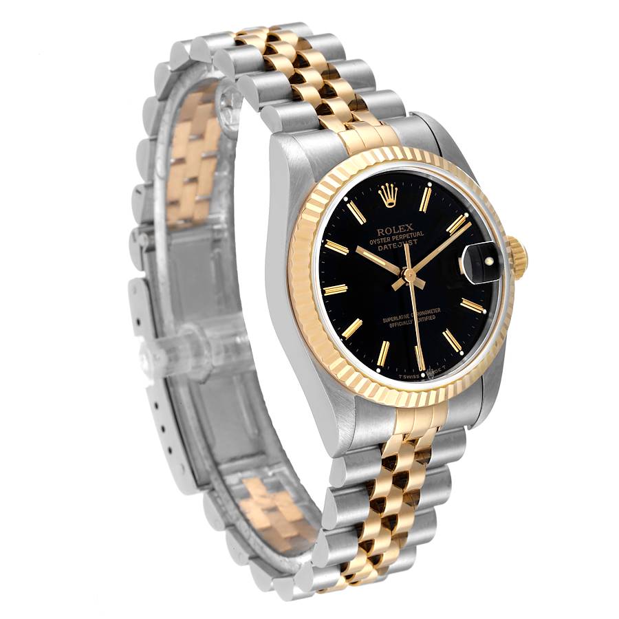 The Rolex Mid-Size watch is shown at a front angle displaying its dial, bezel, and metal bracelet with gold and silver links.