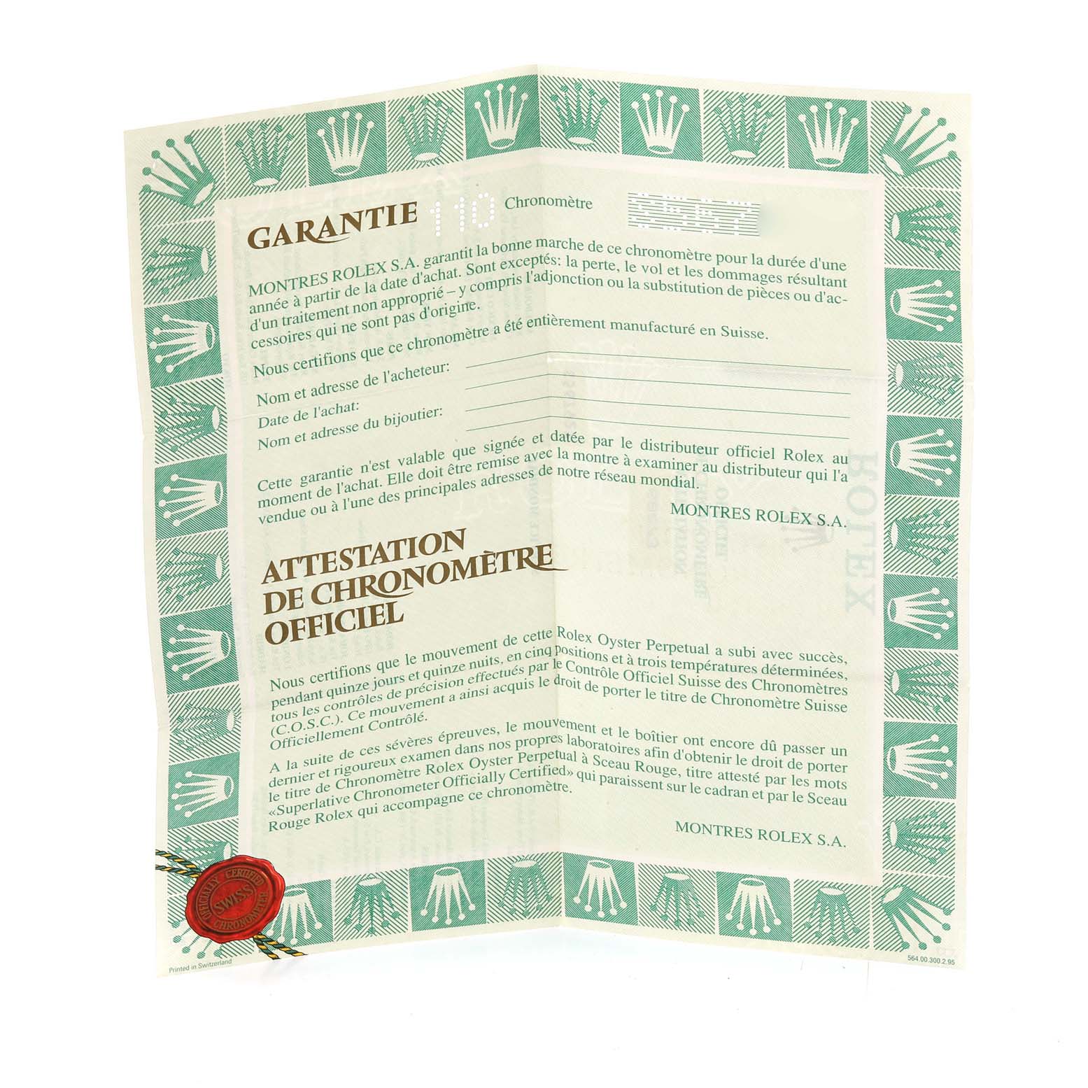 The image shows the warranty and chronometer certificate for a Mid-Size Rolex watch, displayed flat with green border detailing.