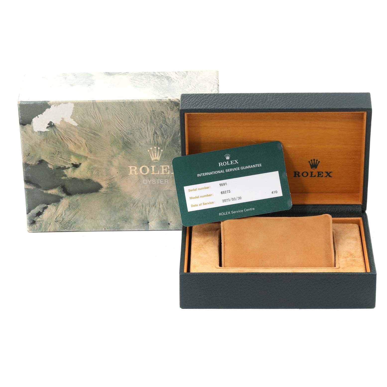 The image shows the packaging and international service guarantee card for a Rolex Mid-Size 68273 Women
s Steel and Gold (two tone) Champagne Dial 68273 Women
s Steel and Gold (two tone) Champagne Dial watch.