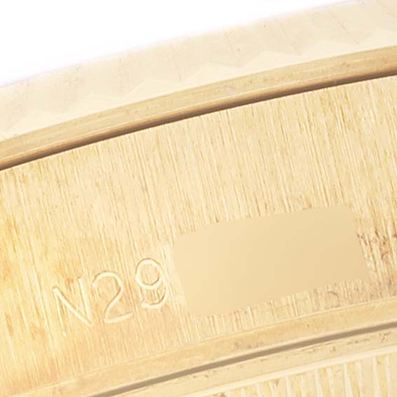 Close-up view of the engraved serial number on the Rolex President 69178 Women's Yellow Gold White Dial 69178 Women's Yellow Gold White Dial model watch case.