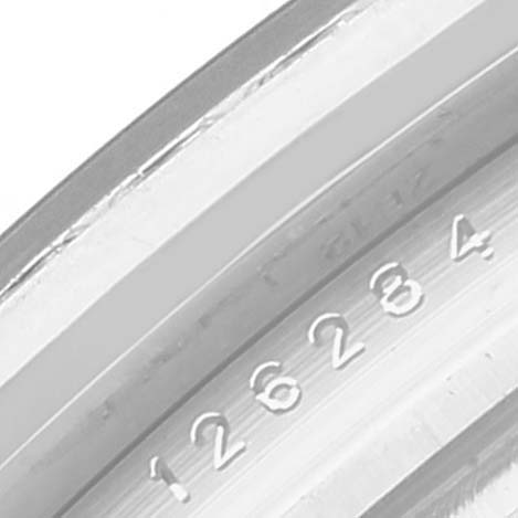 This is a close-up image of the bezel and engraved edge of a Rolex Datejust 126284 Men's Stainless Steel Silver Dial 126284 Men's Stainless Steel Silver Dial watch.