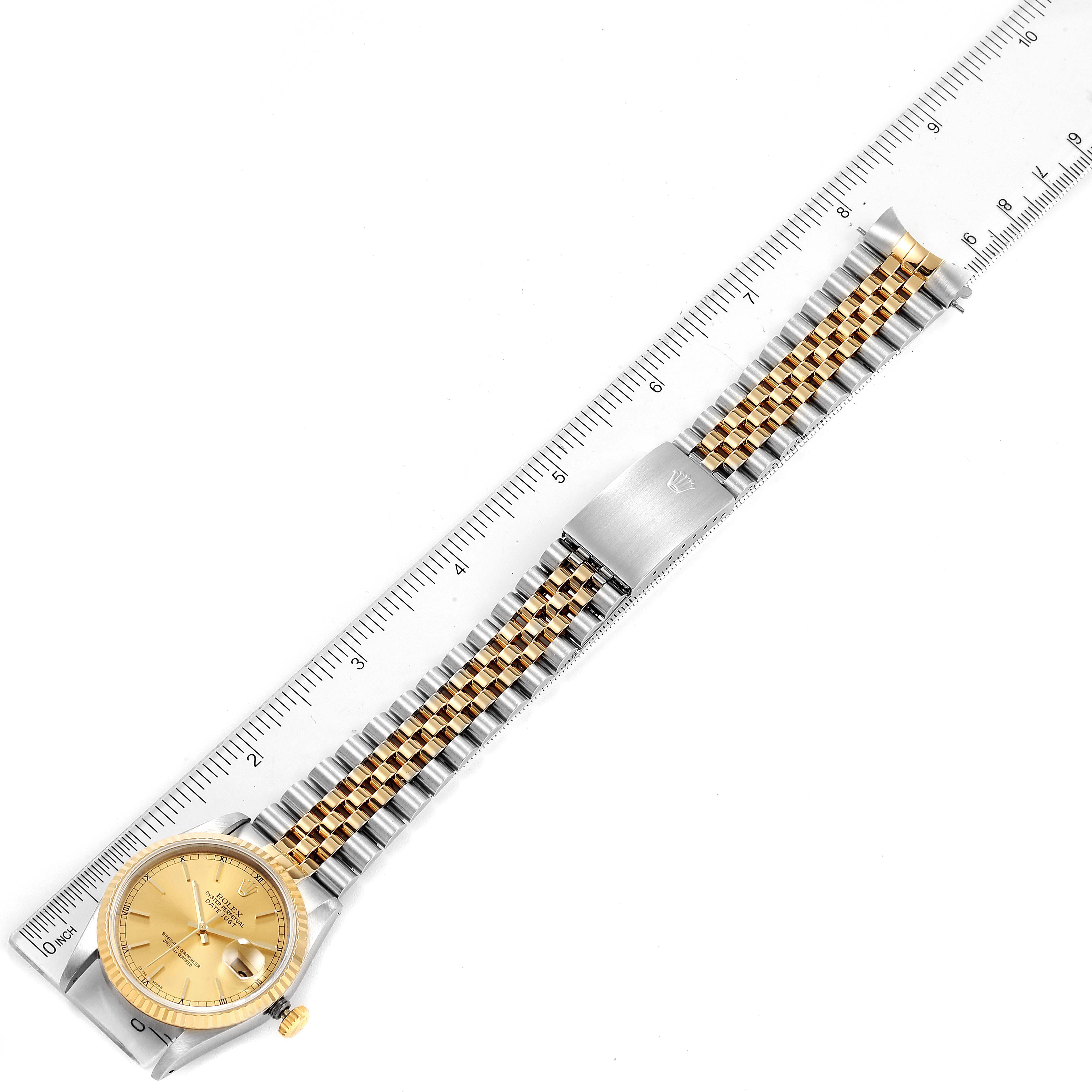 The image shows a Rolex Datejust 16233 Men's Steel and Gold (two tone) Champagne Dial 16233 Men's Steel and Gold (two tone) Champagne Dial watch laid flat with a ruler next to it, highlighting the case, dial, and bracelet.