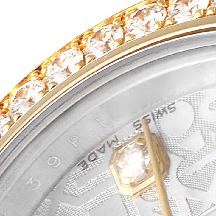 The image shows a close-up of the diamond-encrusted bezel and part of the dial of a Rolex Datejust 179383 Women
s Steel and Gold (two tone) Silver Dial 179383 Women
s Steel and Gold (two tone) Silver Dial watch.
