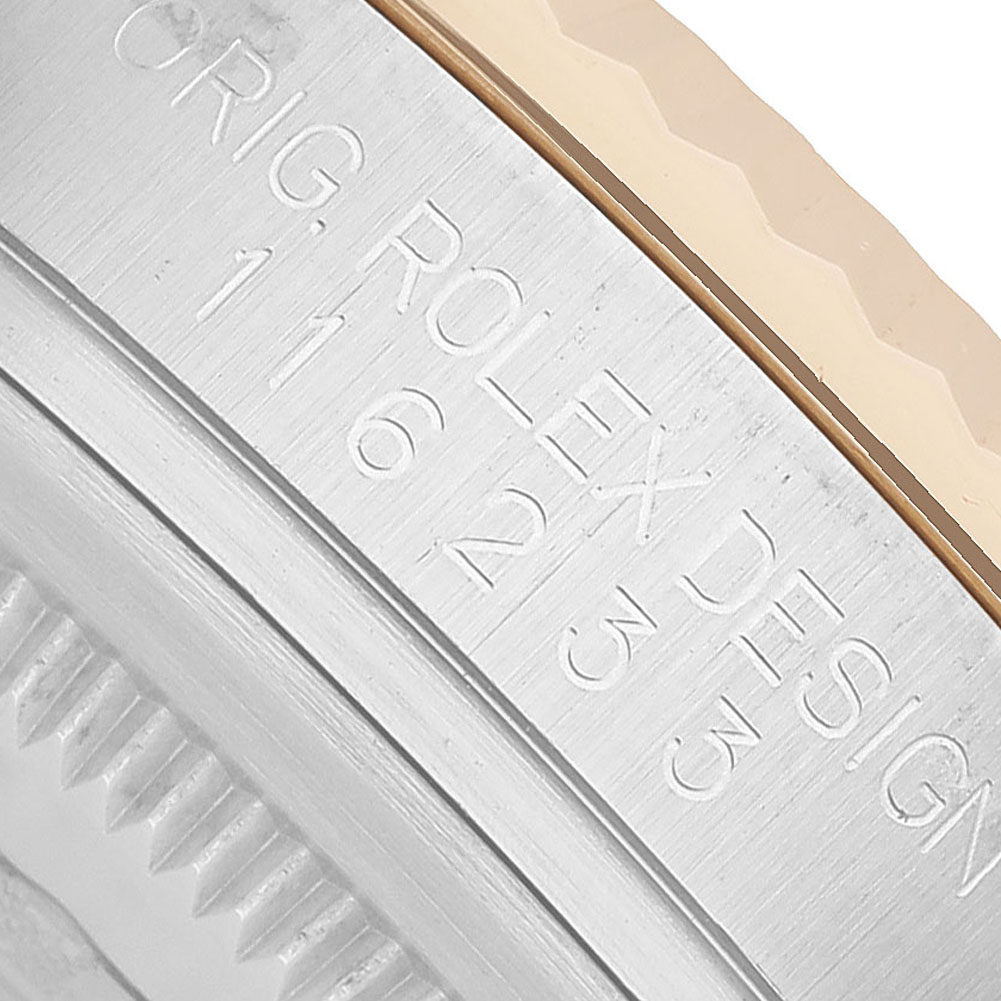 The image shows a close-up of the engraved side of a Rolex Datejust 116233 Men's Steel and Gold (two tone) Champagne Dial watch case.