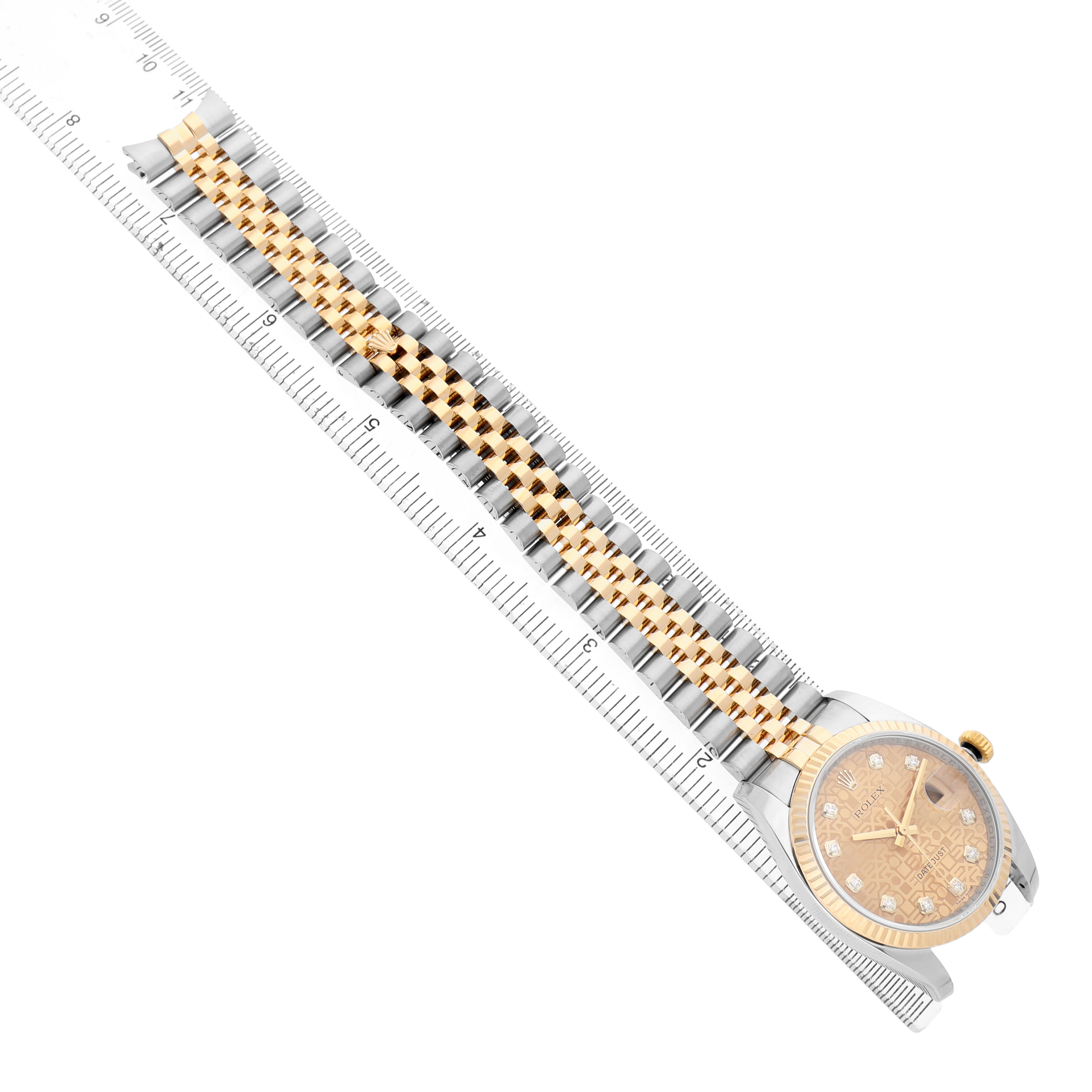 The image shows a Rolex Datejust 116233 Men's Steel and Gold (two tone) Champagne Dial watch from a top angle, highlighting the bracelet and partial view of the watch face and case.