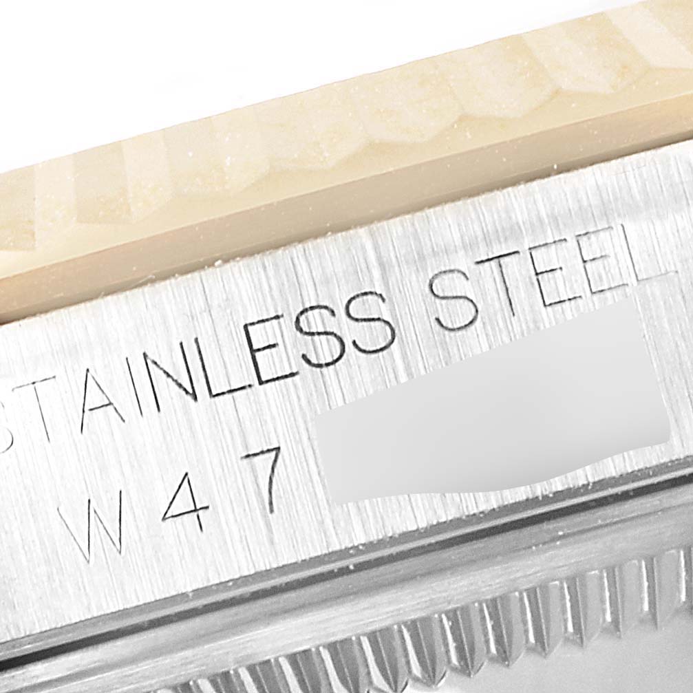 This image shows a close-up of the side edge of a Rolex Datejust 16233 Men's Steel and Gold (two tone) Champagne Dial 16233 Men's Steel and Gold (two tone) Champagne Dial watch, highlighting the "STAINLESS STEEL" text.