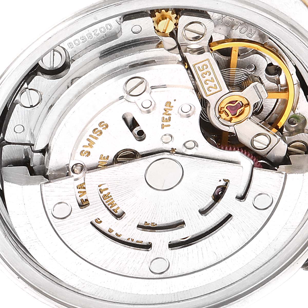 This image shows a close-up view of the movement inside a Rolex Datejust 79173 Women
s Steel and Gold (two tone) Black Dial 79173 Women
s Steel and Gold (two tone) Black Dial watch, highlighting its intricate mechanical parts.