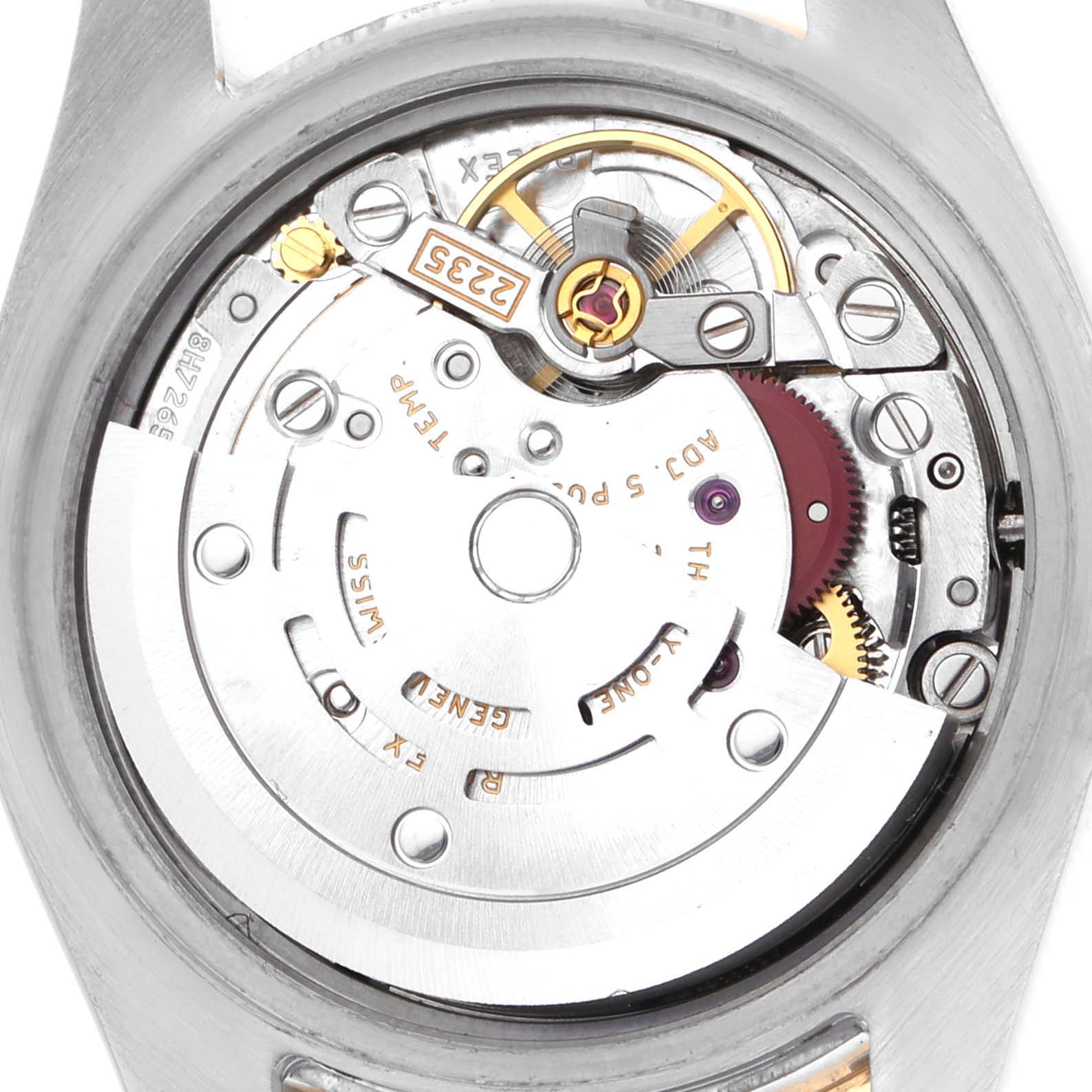 The image shows the movement of a Rolex Datejust 179383 Women's Steel and Gold (two tone) Silver Dial, viewed from the back, highlighting intricate mechanical parts.
