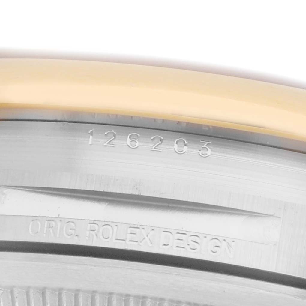 The image shows a close-up of the side engraving on a Rolex Datejust 126203 Men
s Steel and Gold (two tone) Silver Dial, highlighting the model number and "ORIG. ROLEX DESIGN."