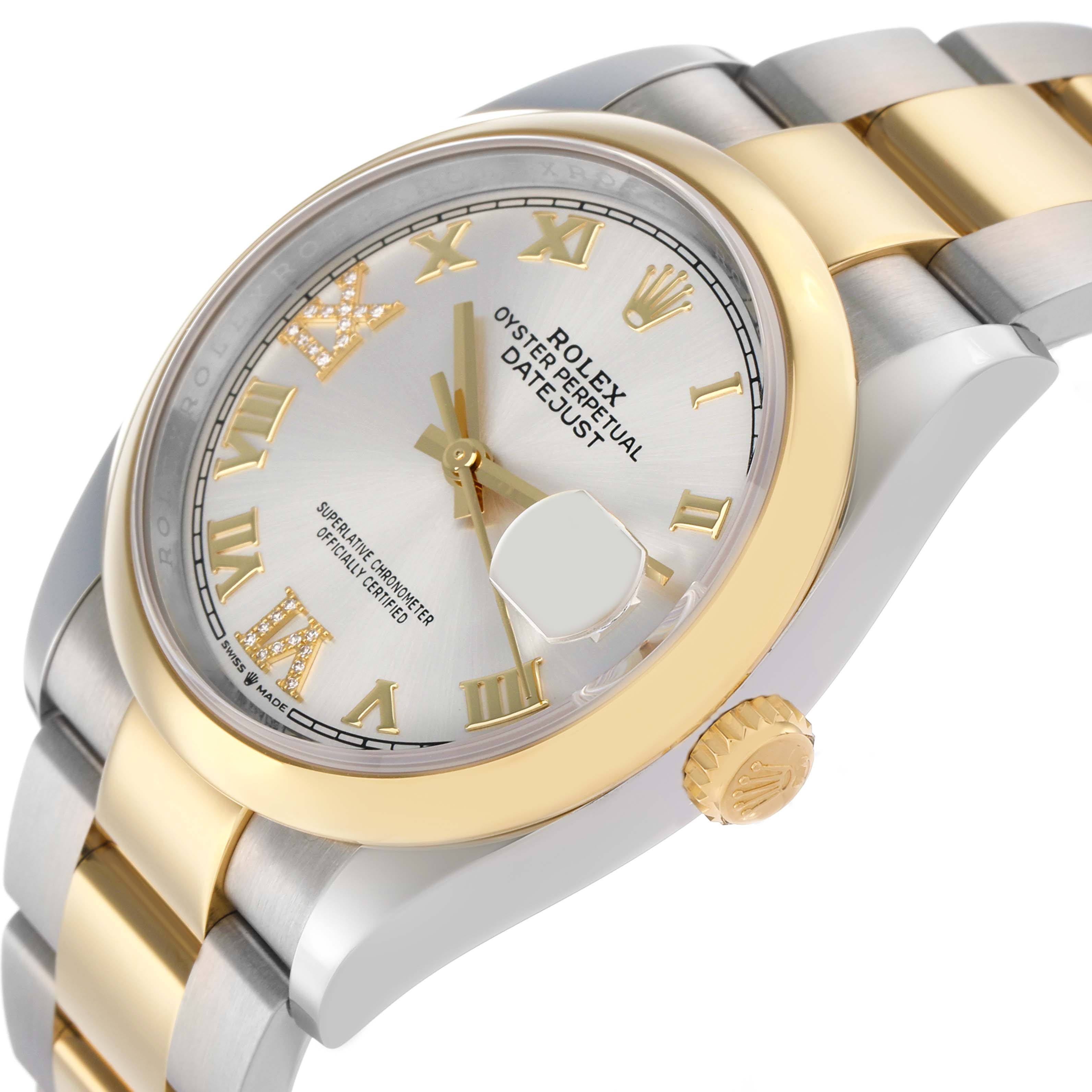 The Rolex Datejust 126203 Men
s Steel and Gold (two tone) Silver Dial watch is shown at an angled side view, highlighting the face, bezel, crown, and part of the bracelet.
