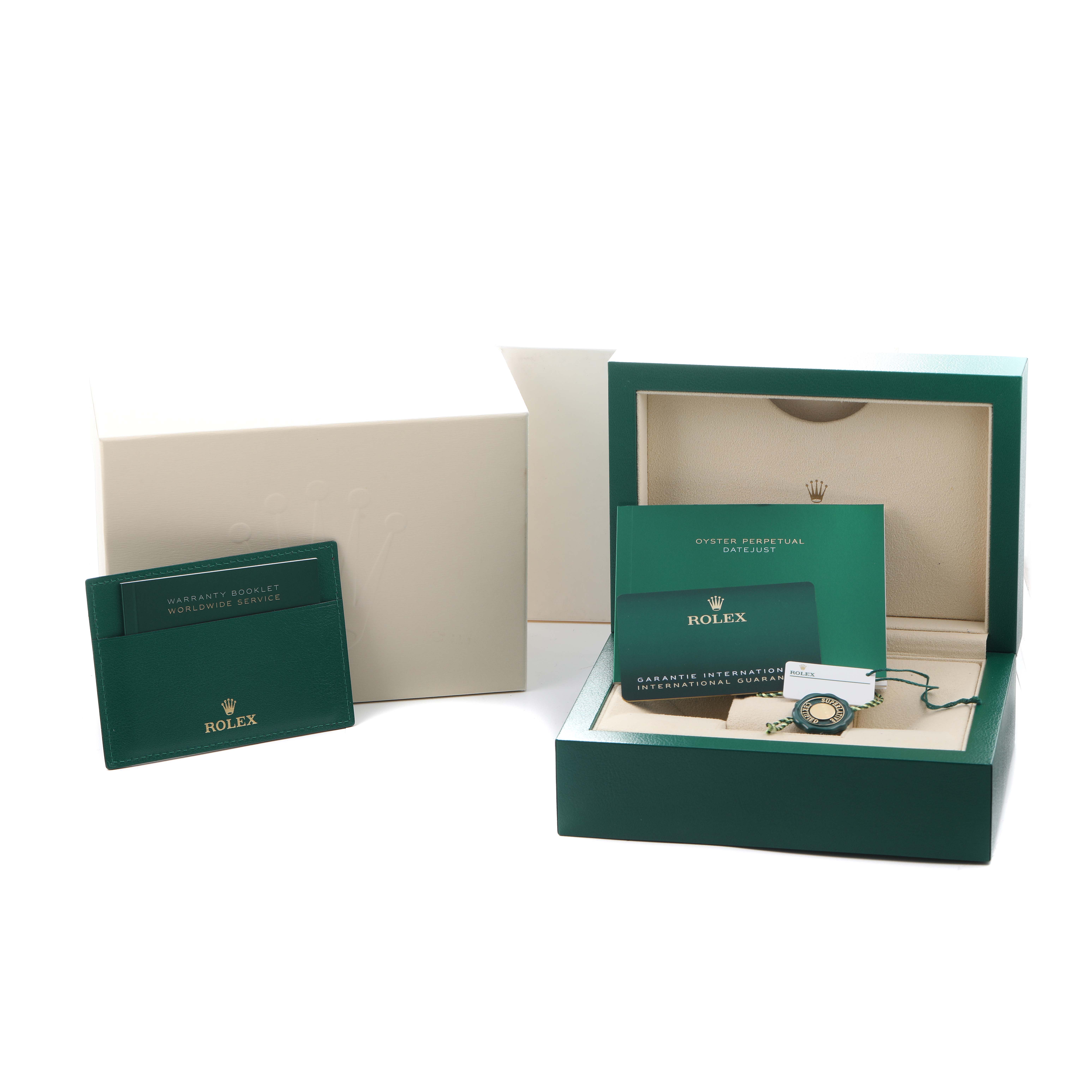 The image shows a Rolex Datejust 126203 Men
s Steel and Gold (two tone) Silver Dial box with warranty booklets, cards, and a tag, viewed slightly from above.