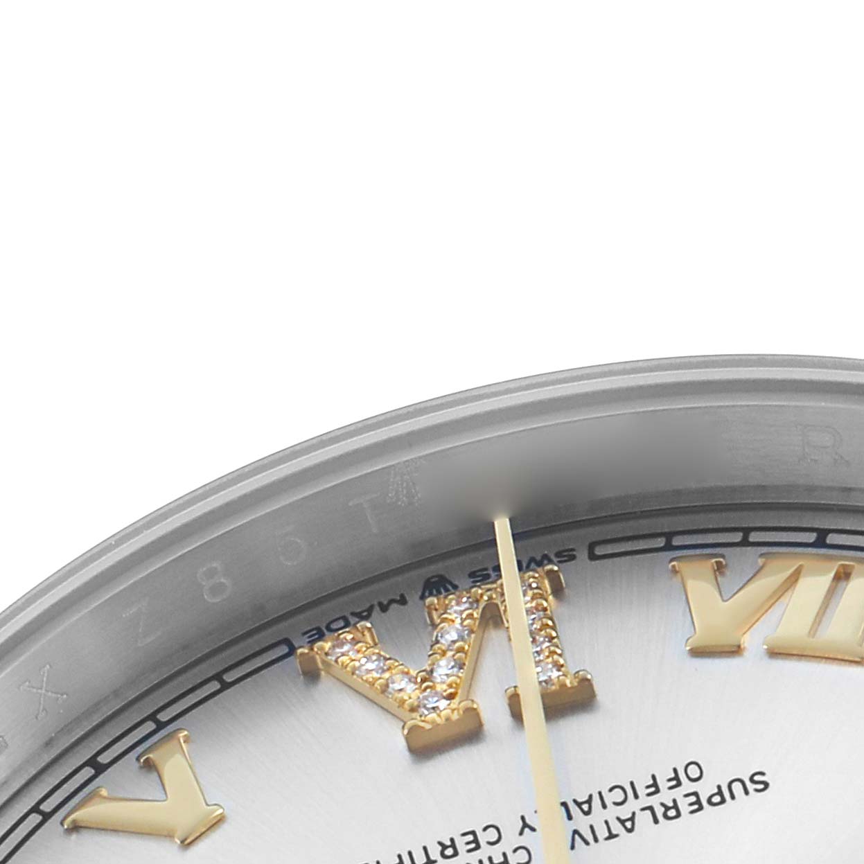 The image shows a close-up of the Rolex Datejust 126203 Men
s Steel and Gold (two tone) Silver Dial watch dial, featuring part of the Roman numeral "VI" and a portion of the seconds hand.