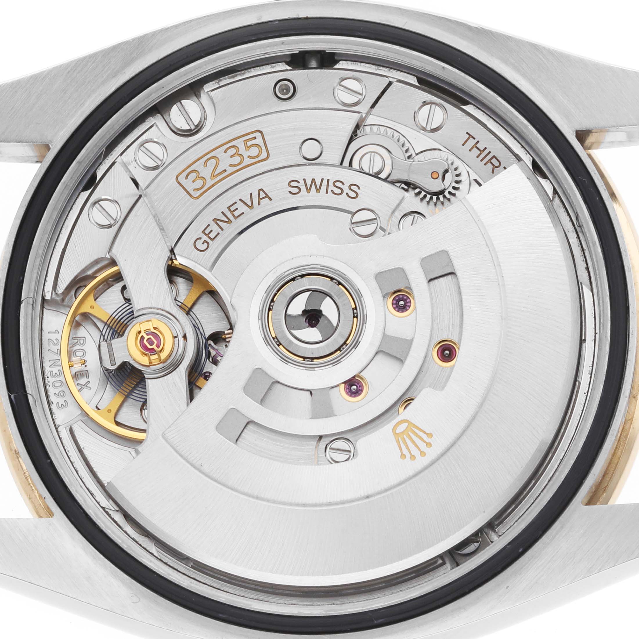 The image shows the movement of a Rolex Datejust 126283 Men's Steel and Gold (two tone) Mother of Pearl Dial watch from the back, highlighting the intricate mechanical parts.