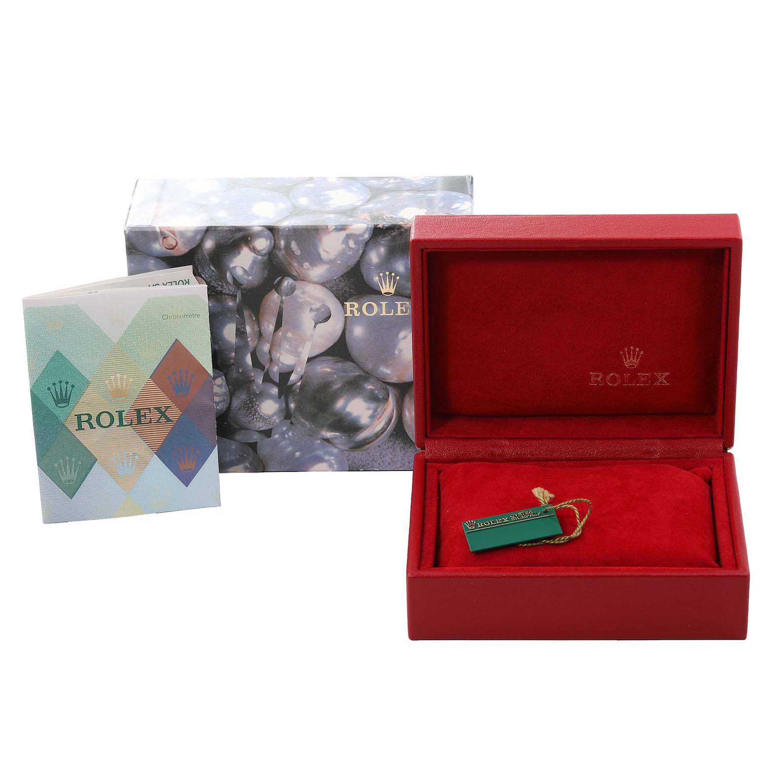 The image shows a Rolex Datejust 79173 Women's Steel and Gold (two tone) Beige Dial 79173 Women's Steel and Gold (two tone) Beige Dial watch box, a Rolex-branded booklet, and a green tag, all from a front angle.