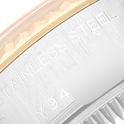 This close-up shows the stainless steel back and part of the bezel of a Rolex Datejust 79173 Women's Steel and Gold (two tone) Beige Dial 79173 Women's Steel and Gold (two tone) Beige Dial watch.