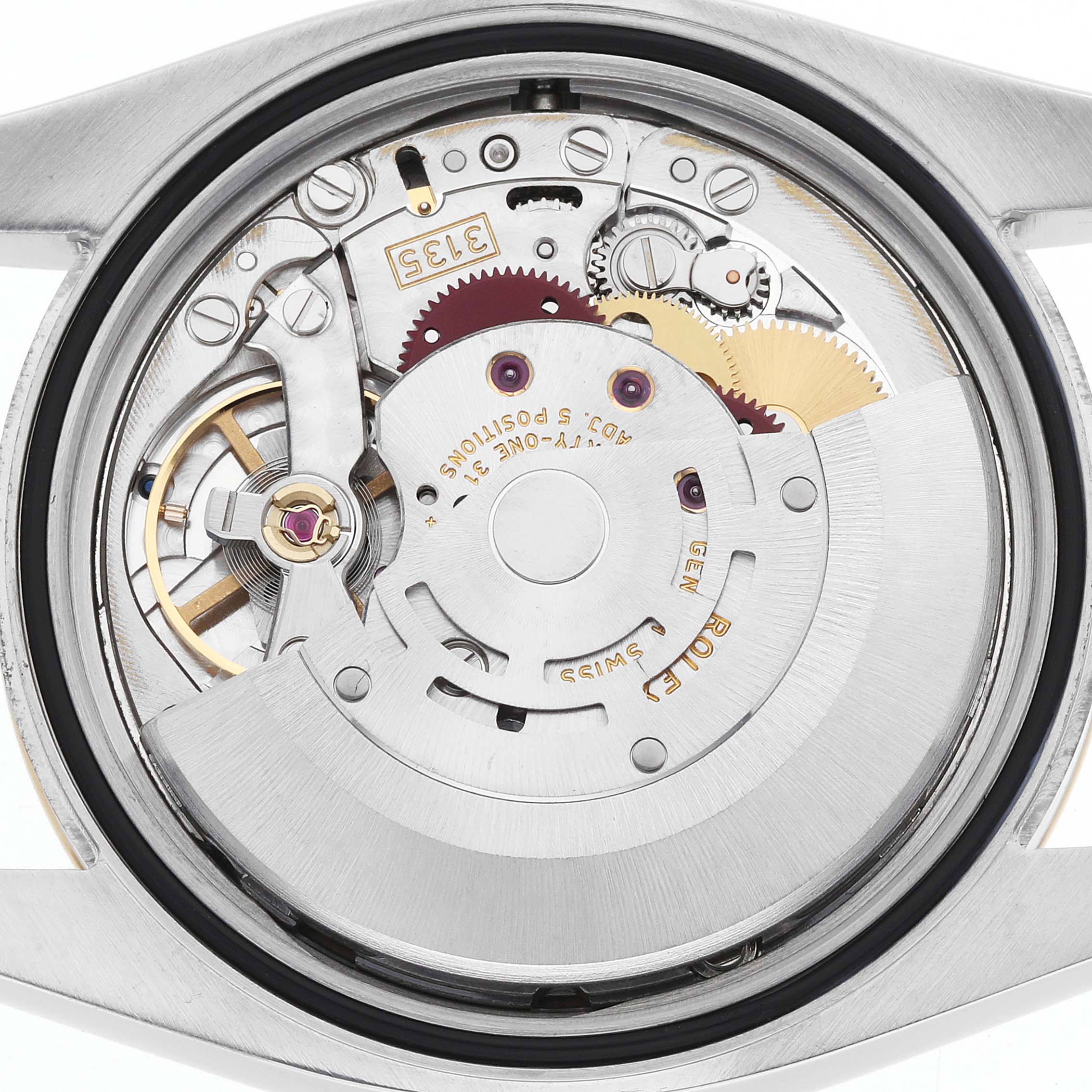 The image shows a close-up of the movement of a Rolex Datejust 116233 Men's Steel and Gold (two tone) White Dial, featuring gears and the oscillating weight.