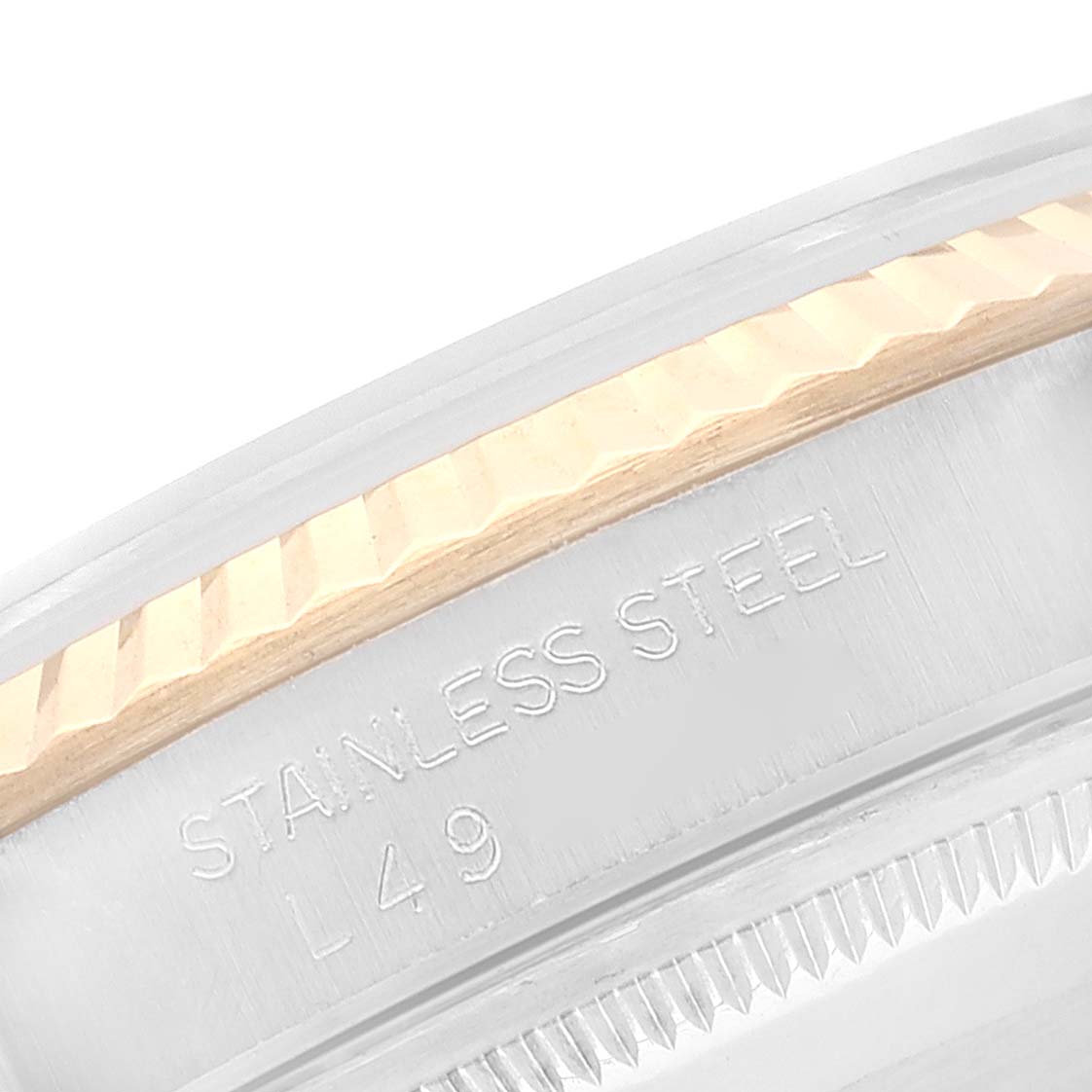 This image shows a close-up of the fluted bezel and stainless steel case of a Rolex Datejust 16233 Men's Steel and Gold (two tone) White Dial 16233 Men's Steel and Gold (two tone) White Dial watch.