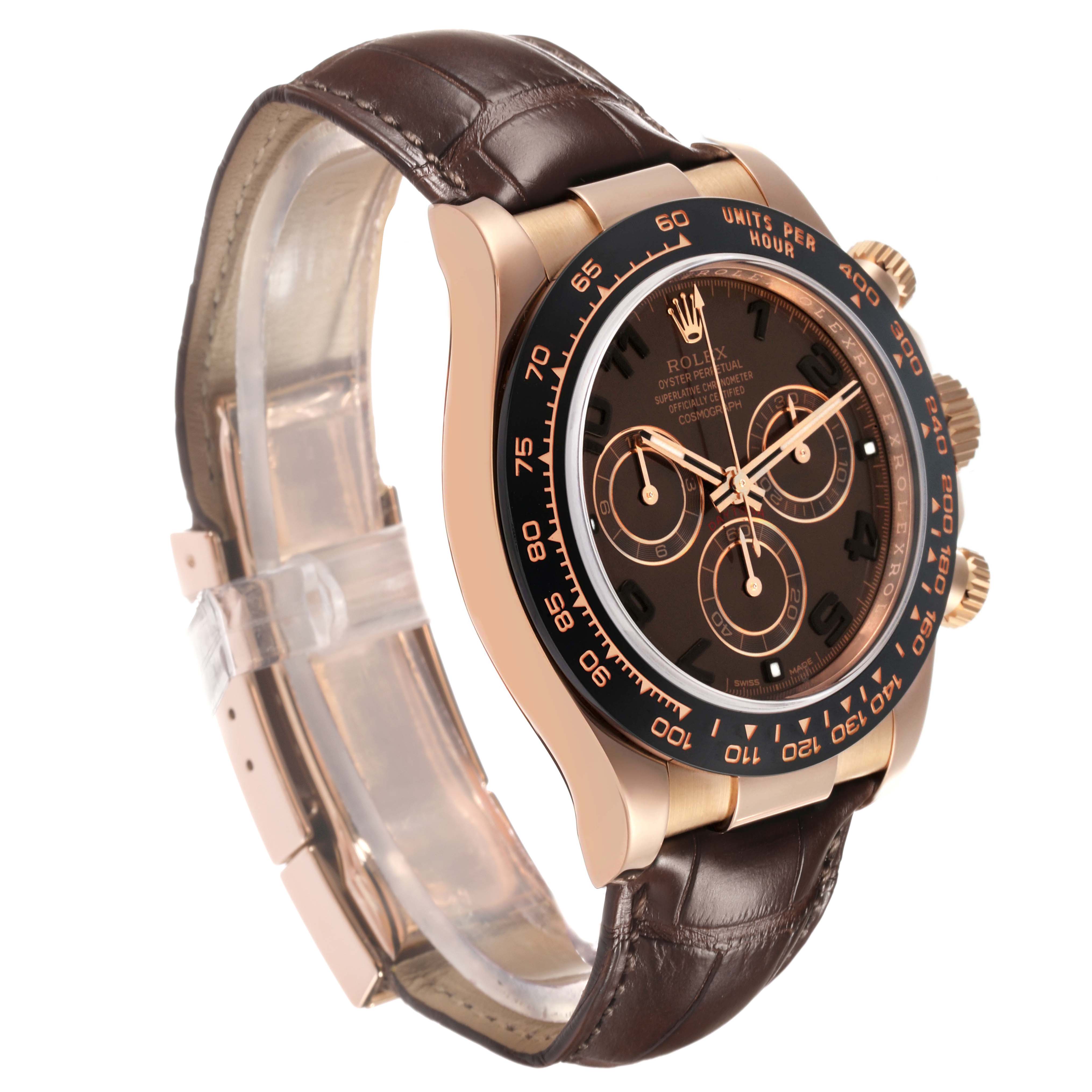 The Rolex Daytona 116515LN Men
s Rose Gold Brown Dial watch is shown from a three-quarter angle, displaying the face, bezel, crown, and leather strap.