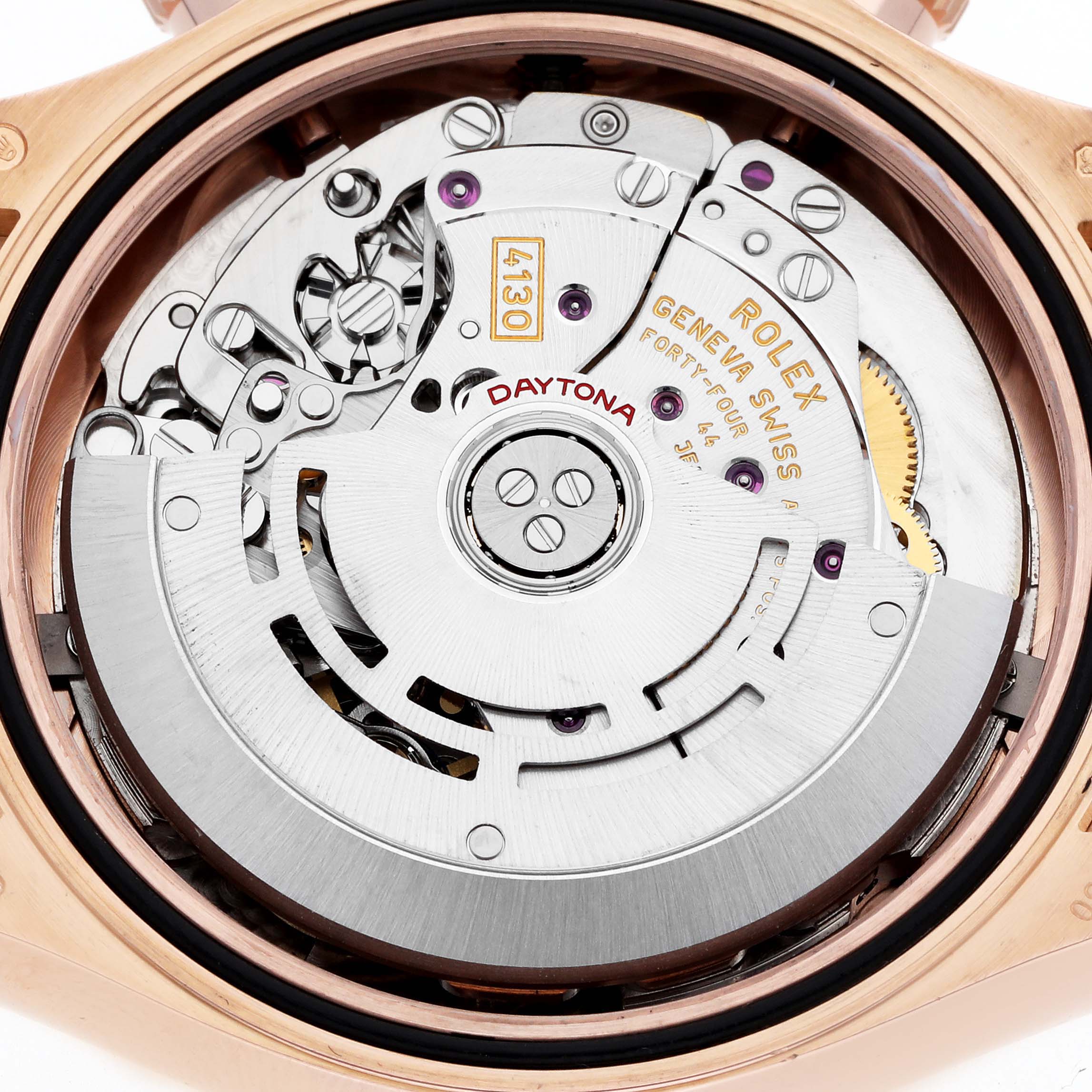 The image shows the movement mechanism of a Rolex Daytona 116515LN Men
s Rose Gold Pink Dial watch from a top-down angle, highlighting the rotor and gears.