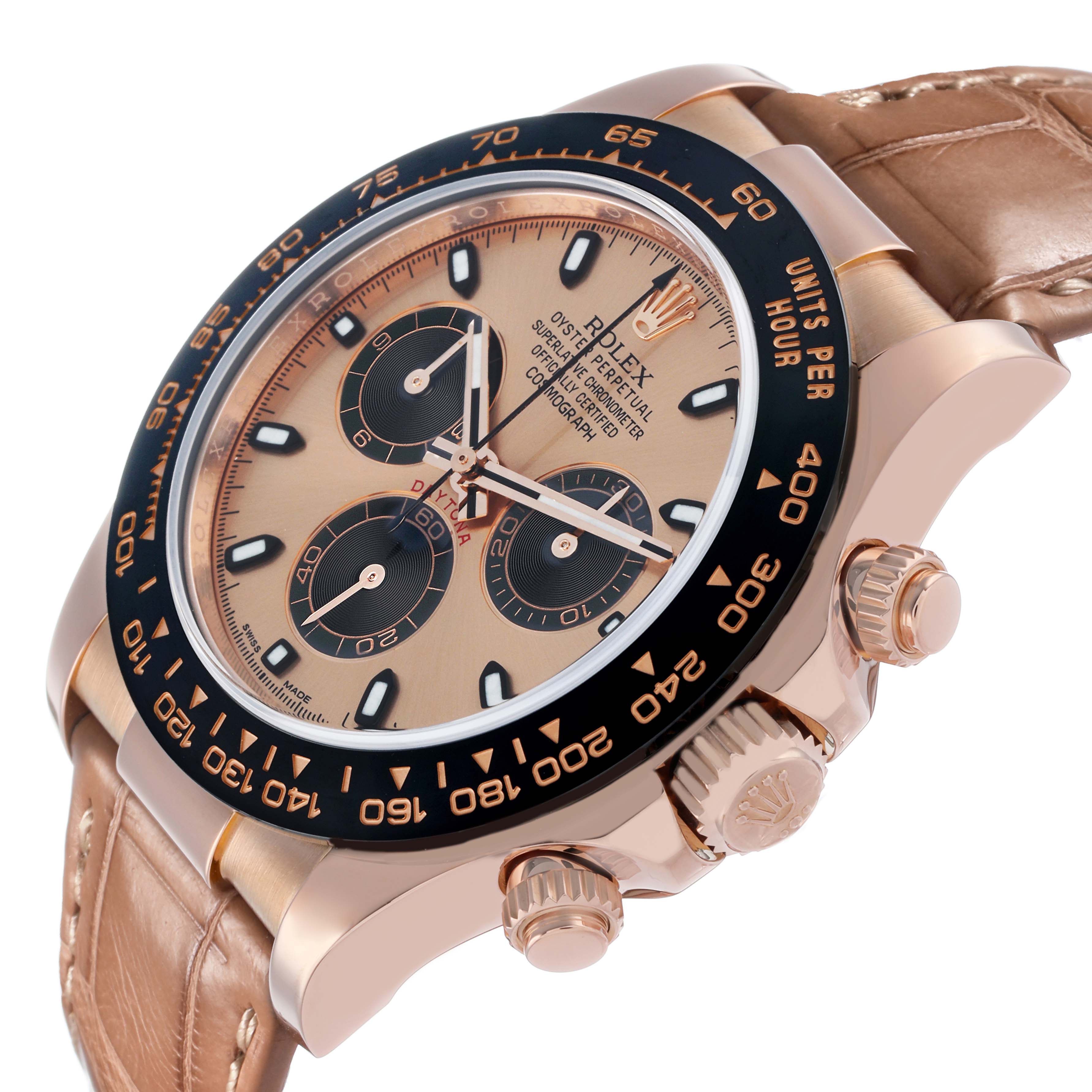 The Rolex Daytona 116515LN Men
s Rose Gold Pink Dial watch is shown at an oblique angle, highlighting the face, bezel, and crown on a leather strap.