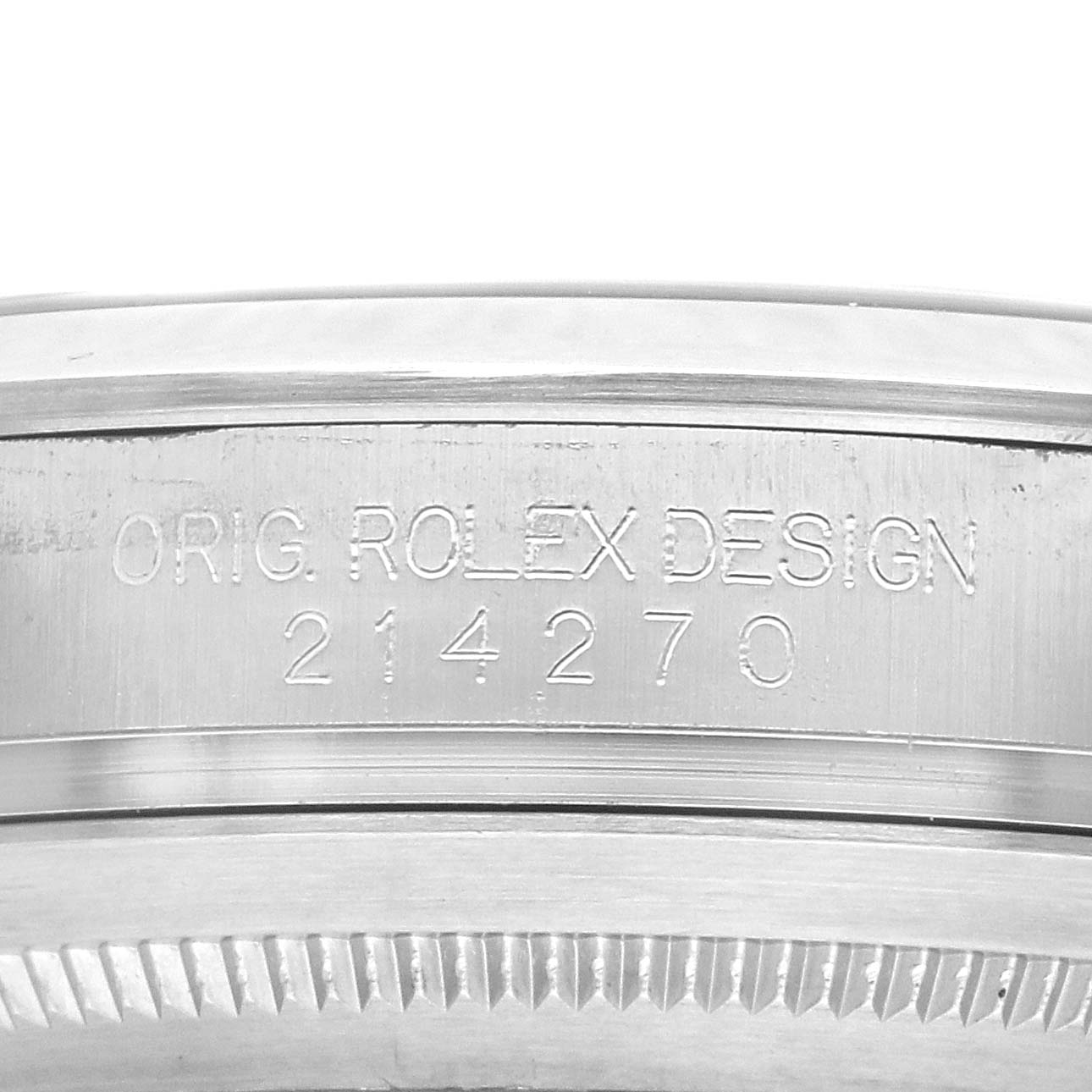 The image shows the side engraving on a Rolex Explorer 214270 Men's Stainless Steel Black Dial's case, displaying "ORIG. ROLEX DESIGN 214270."