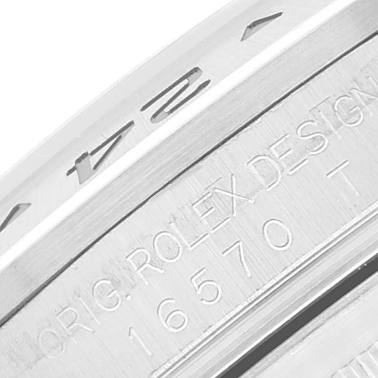 This close-up image shows the engraved serial number and model details on the side of a Rolex Explorer 16570 Men
s Stainless Steel Black Dial 16570 Men
s Stainless Steel Black Dial watch.