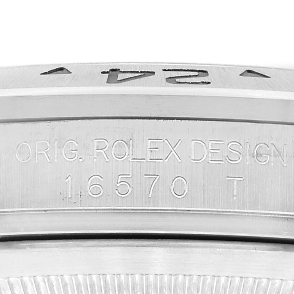 The image shows a close-up of the engraving on the side of a Rolex Explorer 16570 Men
s Stainless Steel Black Dial 16570 Men
s Stainless Steel Black Dial watch, displaying the model number "16570".