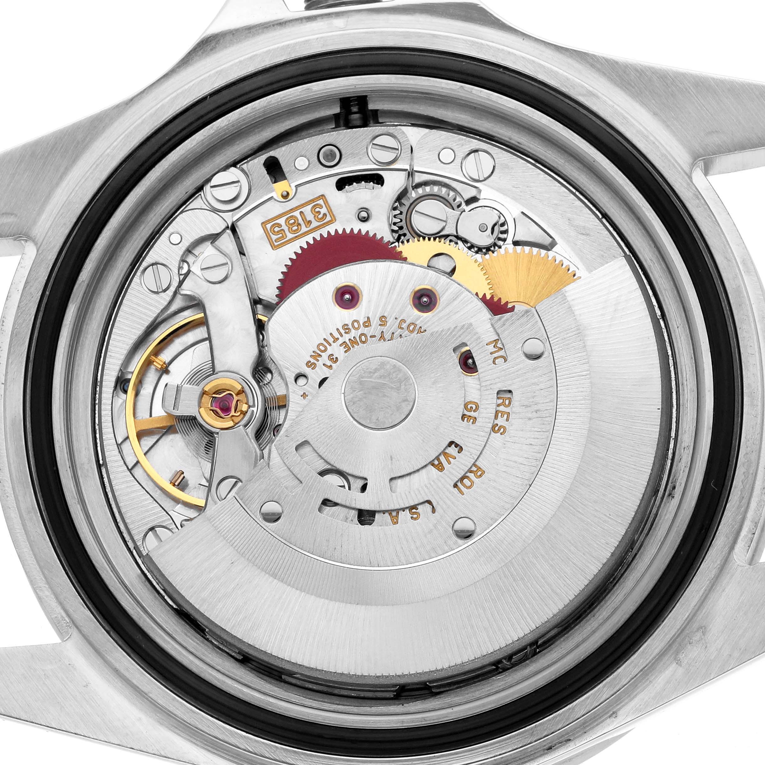 The image shows the Rolex Explorer 16570 Men
s Stainless Steel Black Dial
s movement from the back, highlighting gears and the rotor mechanism.