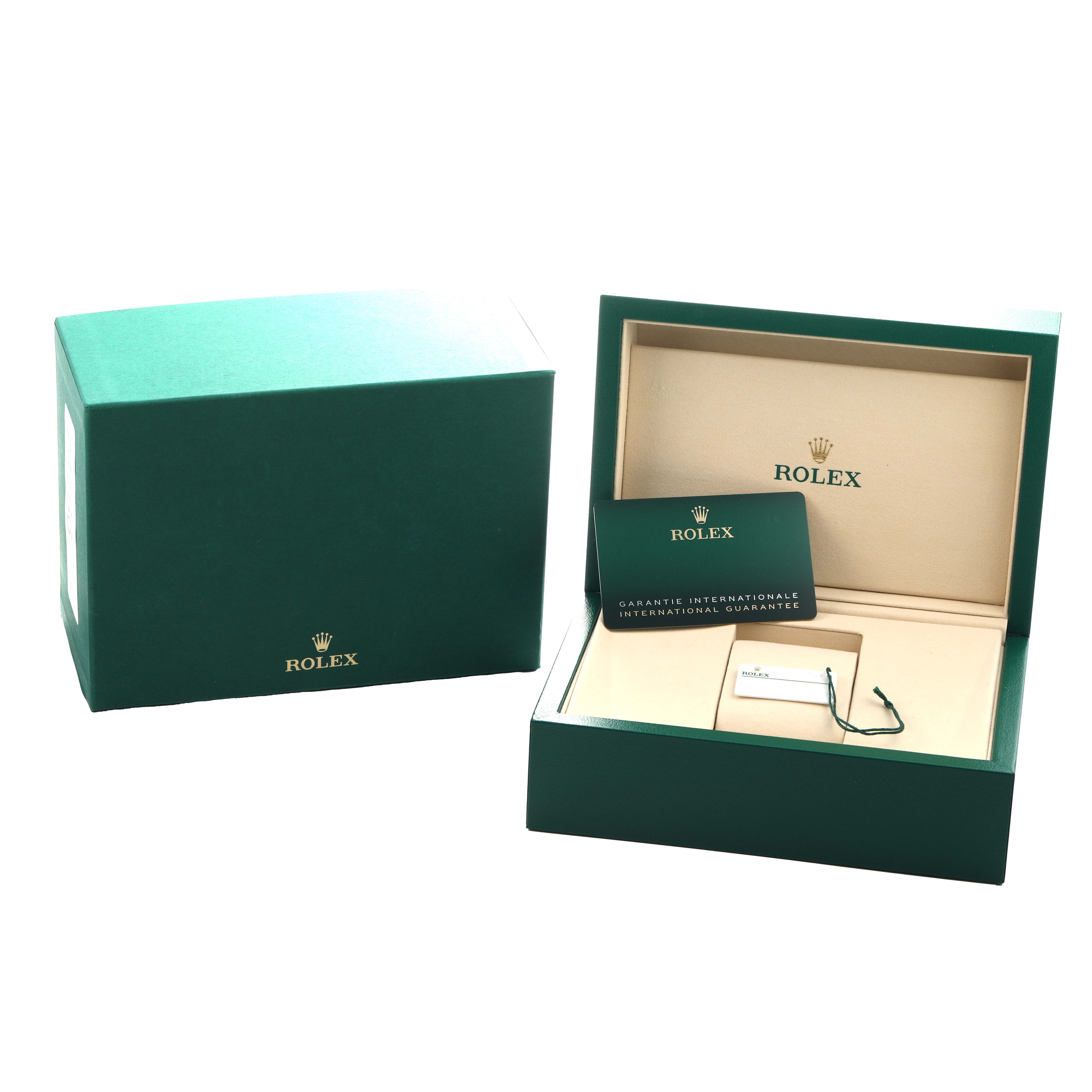 The image shows a Rolex GMT-Master 126710GRNR Men's Stainless Steel Black Dial watch box, an outer box, and a warranty card at an angle revealing the packaging contents.