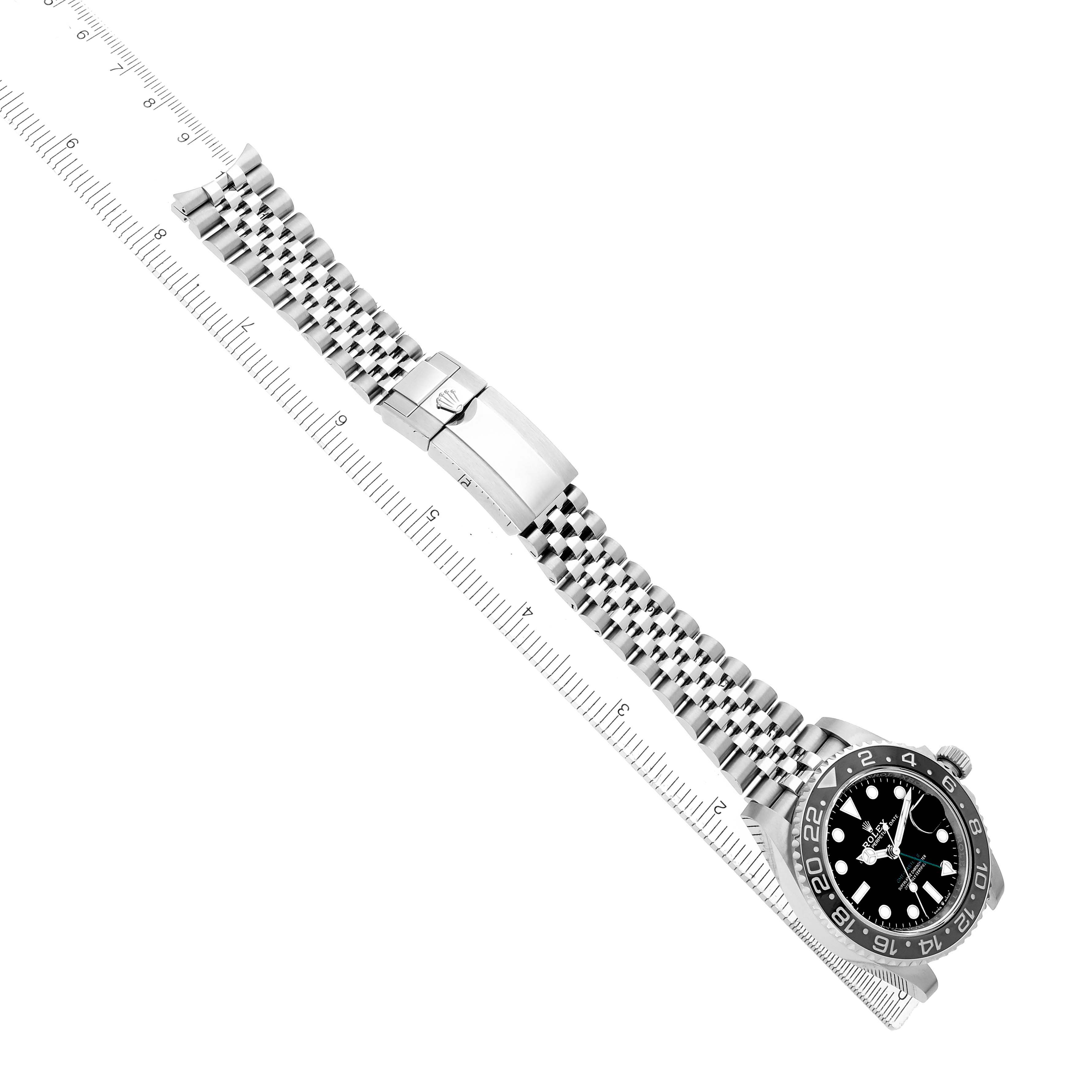 The Rolex GMT-Master 126710GRNR Men's Stainless Steel Black Dial watch is shown from an overhead angle, displaying the face, bezel, bracelet, and clasp.