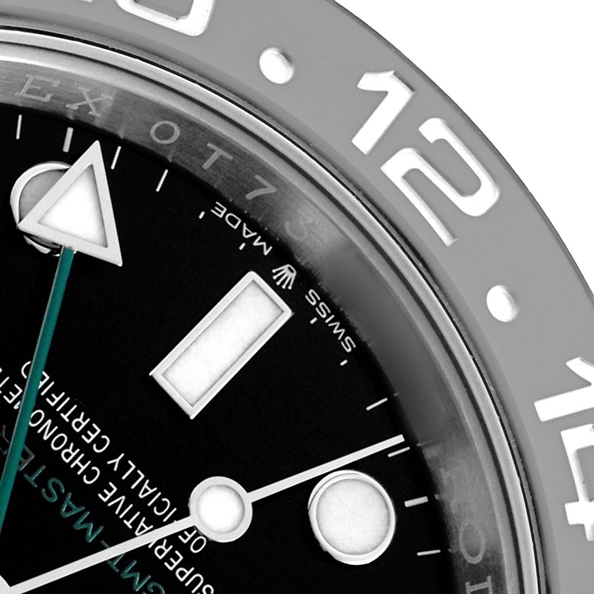 The image shows a close-up of the Rolex GMT-Master 126710GRNR Men's Stainless Steel Black Dial's bezel and part of its dial, focusing on the hour markers and hands.